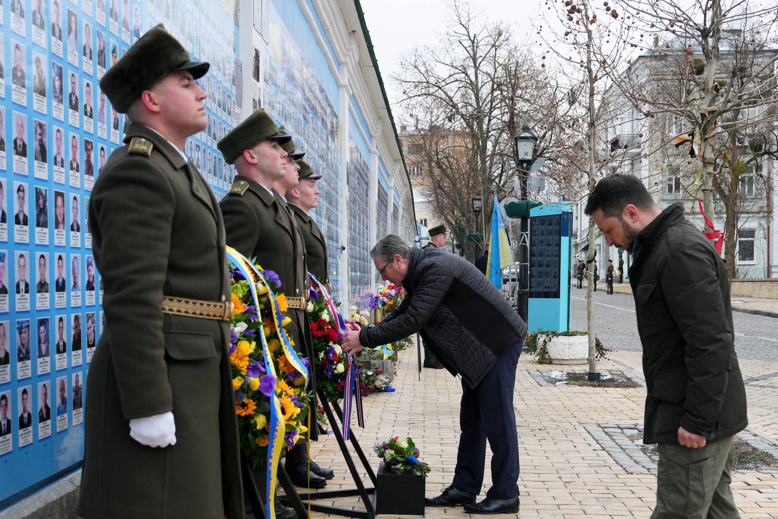 British Prime Minister Keir Starmer and Ukrainian President Volodymyr Zelenskyy lay wreaths at The Wall of Remembrance of the Fallen for Ukraine, in Kyiv, Ukraine Thursday, Jan. 16, 2025. (Carl Court/Pool Photo via AP)