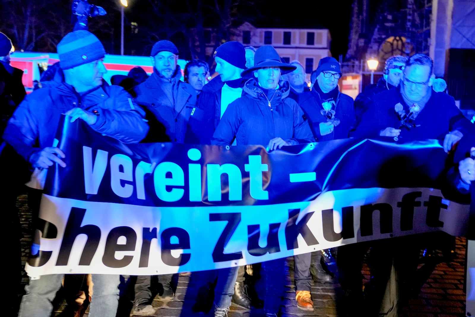 Co leader of German far right party AfD Alice Weidel, centre, attends an AfD election campaign in Magdeburg, Germany, Monday, Dec. 23, 2024. (AP Photo/Ebrahim Noroozi)