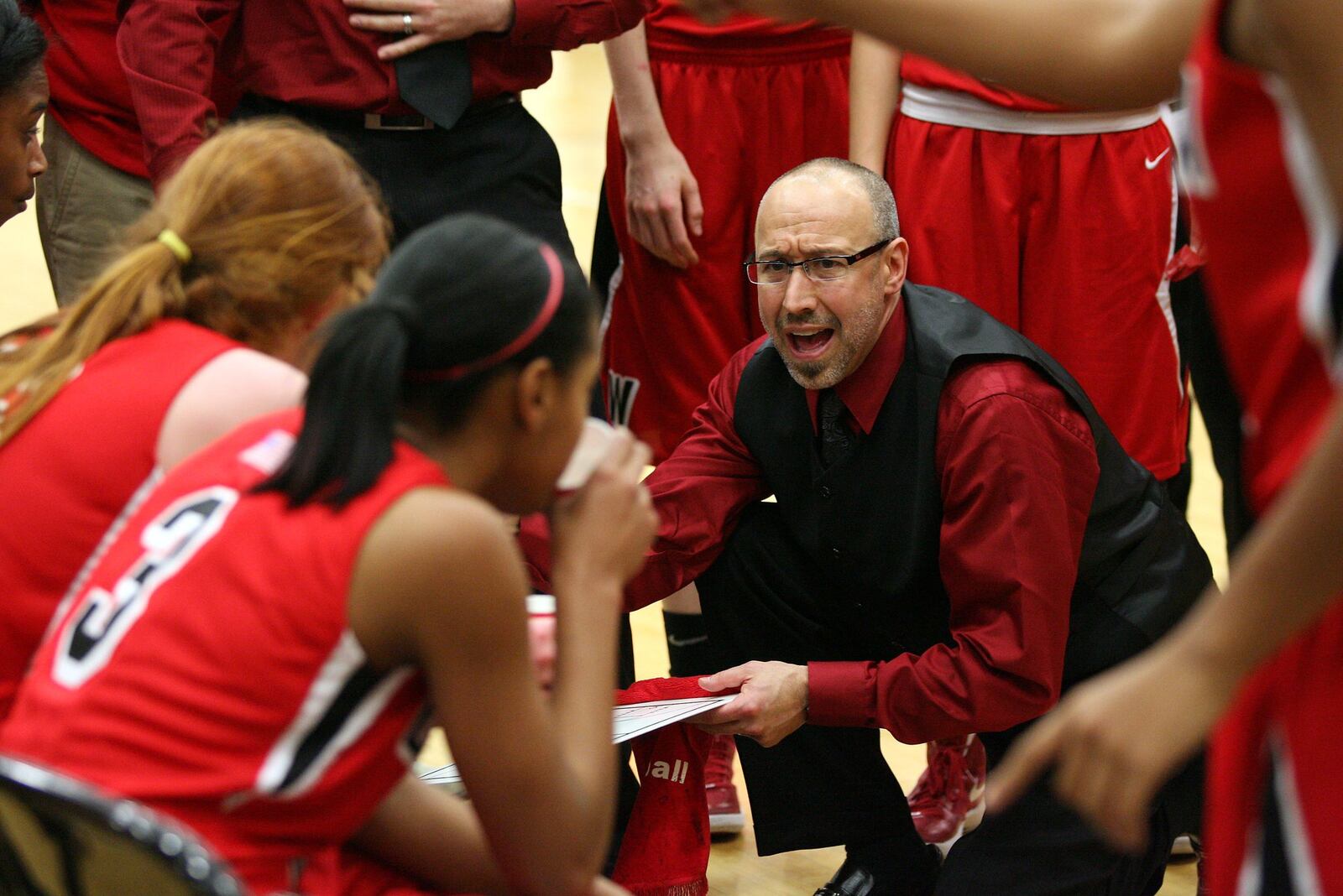 Lakota West coach Andy Fishman talks with his squad during a game at Lakota East on Dec. 14, 2011. JOURNAL-NEWS FILE PHOTO