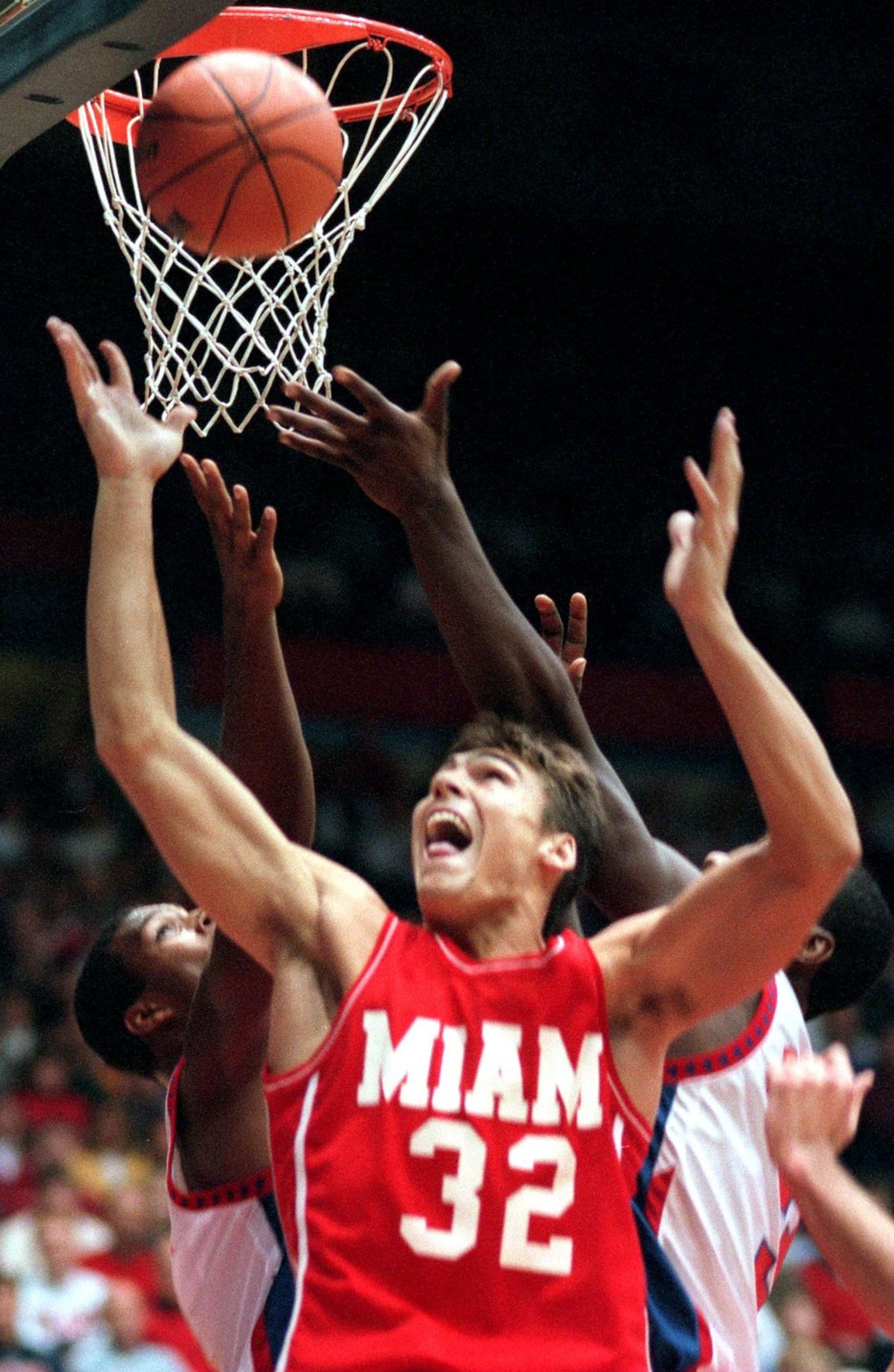 Miami’s Wally Szczerbiak grabs a rebound vs. Dayton on Nov. 24, 1998 at UD Arena. FILE PHOTO