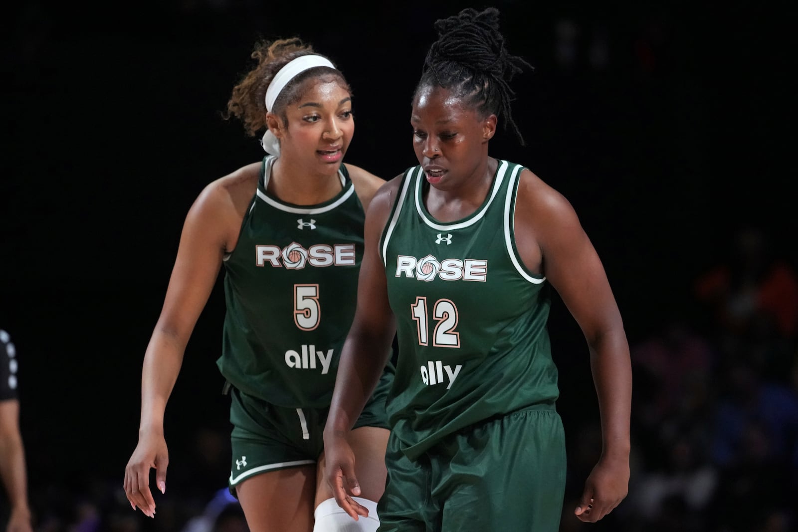 Rose's Angel Reese (5) talks to teammate Chelsea Gray (12) during the first half of an Unrivaled 3-on-3 basketball game against Vinyl, Friday, Jan. 17, 2025, in Medley, Fla. (AP Photo/Marta Lavandier)