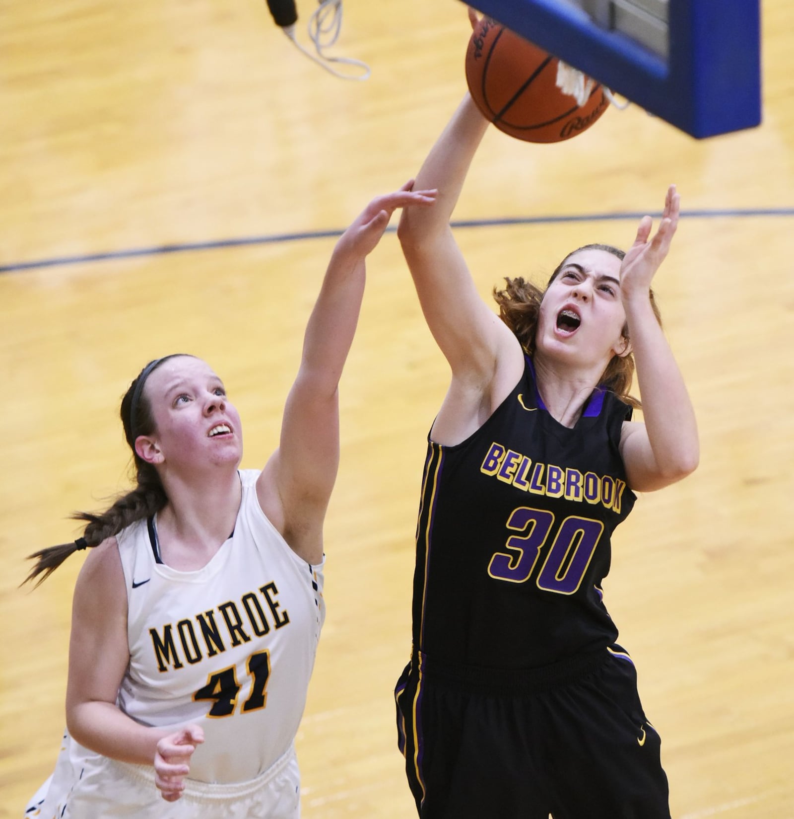 Bellbrook’s Kayla Paul drives to the hoop while being defended by Monroe’s Katie Sloneker during their Jan. 26, 2017, game at Monroe. NICK GRAHAM/STAFF