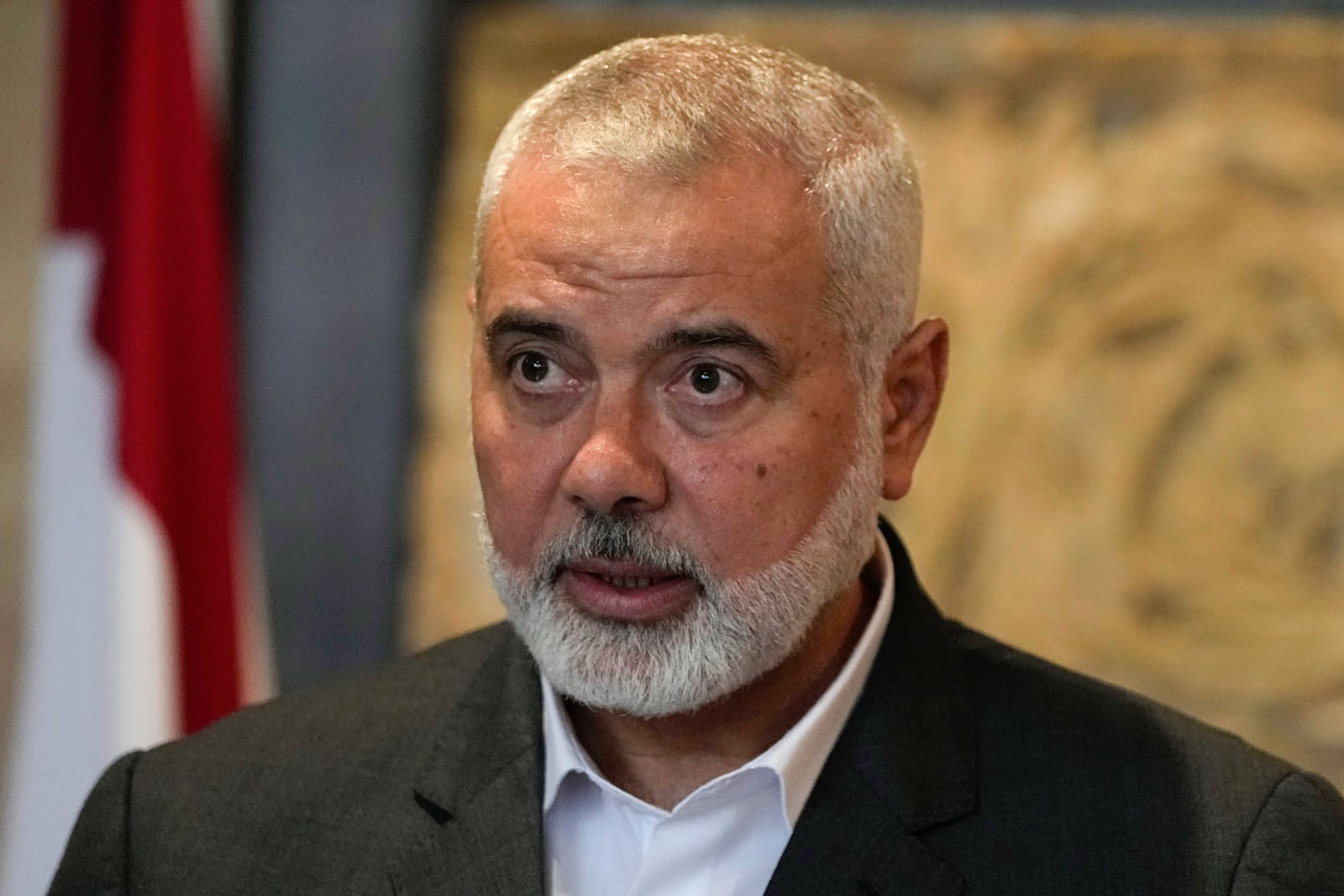 FILE - Ismail Haniyeh, leader of the Palestinian militant group Hamas, speaks to journalists after his meeting with Lebanese Parliament Speaker Nabih Berri, in Beirut, Lebanon, June 28, 2021. (AP Photo/Hassan Ammar, File)