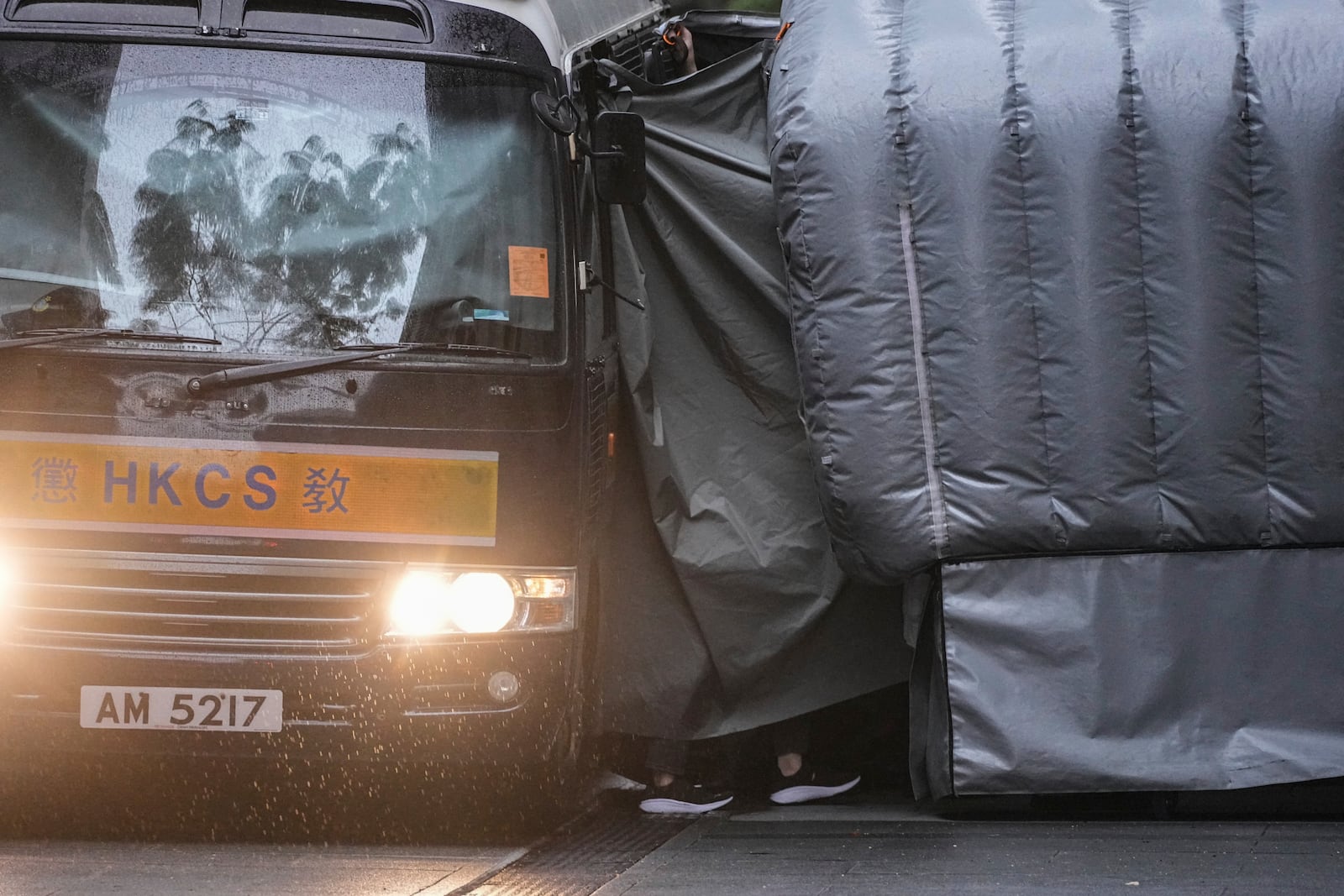 A Correctional Services prison van arrives at the Court of Final Appeal in Hong Kong, Thursday, March 6, 2025. Three former organizers of Hong Kong's annual vigil in remembrance of the 1989 Tiananmen Square crackdown won their bid at the top court on Thursday to overturn their conviction over their refusal to provide information to police, marking a rare victory for the city's pro-democracy activists. (AP Photo/Chan Long Hei)