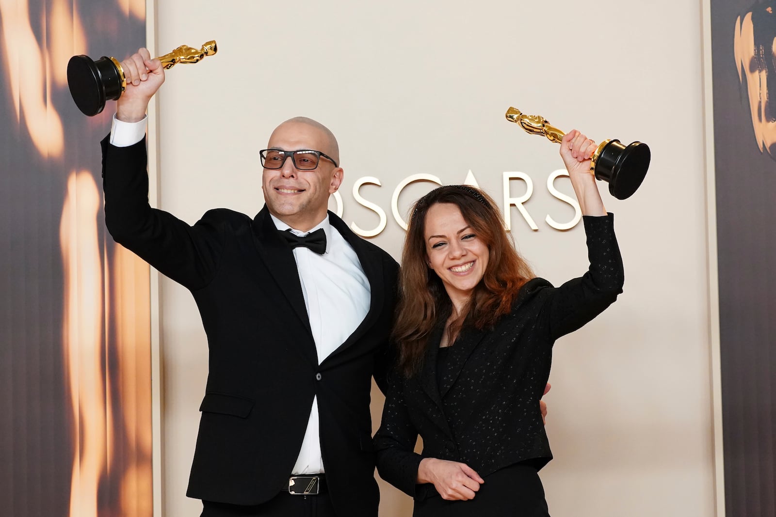 Shirin Sohani, left, and Hossein Molayemi, winners of the award for best animated short for "In the Shadow of the Cypress," pose in the press room at the Oscars on Sunday, March 2, 2025, at the Dolby Theatre in Los Angeles. (Photo by Jordan Strauss/Invision/AP)