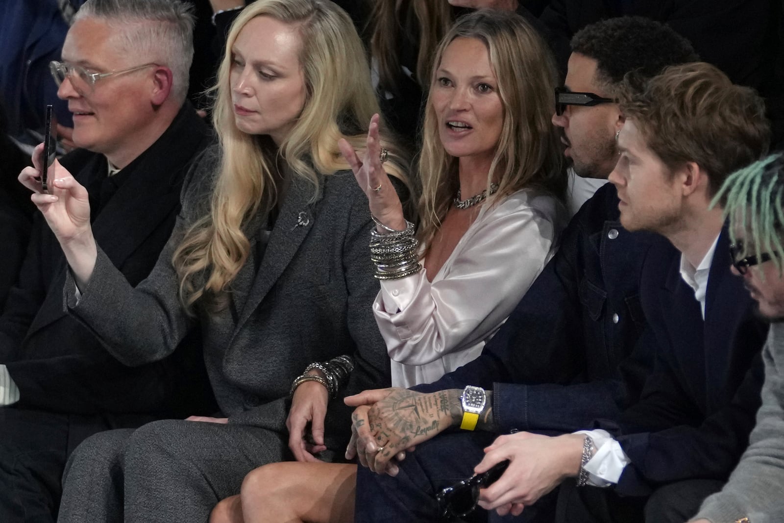 Gwendoline Christie, second left, Kate Moss, center, Miles Chamley-Watson and Joe Alwyn, right, attend the men's Dior Homme Fall-Winter 2025-2026 collection, that was presented in Paris, Friday, Jan. 24, 2025. (AP Photo/Thibault Camus)