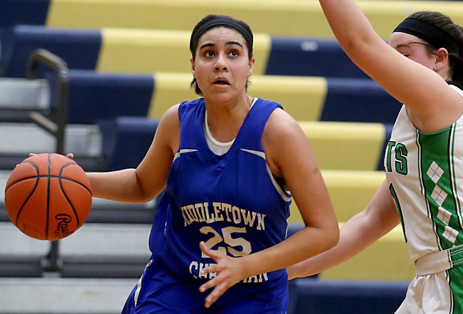 Middletown Christian’s Kayla Arington eyes the hoop while driving past Fayetteville’s Haley Moore on Tuesday night during Division IV sectional play at Monroe. CONTRIBUTED PHOTO BY E.L. HUBBARD