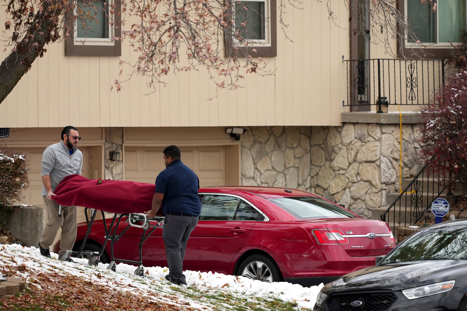 Workers carry a body from the home of former Kansas City, Kan. police detective Roger Golubski on Monday, Dec. 2, 2024, in Edwardsville, Kan. (AP Photo/Charlie Riedel)