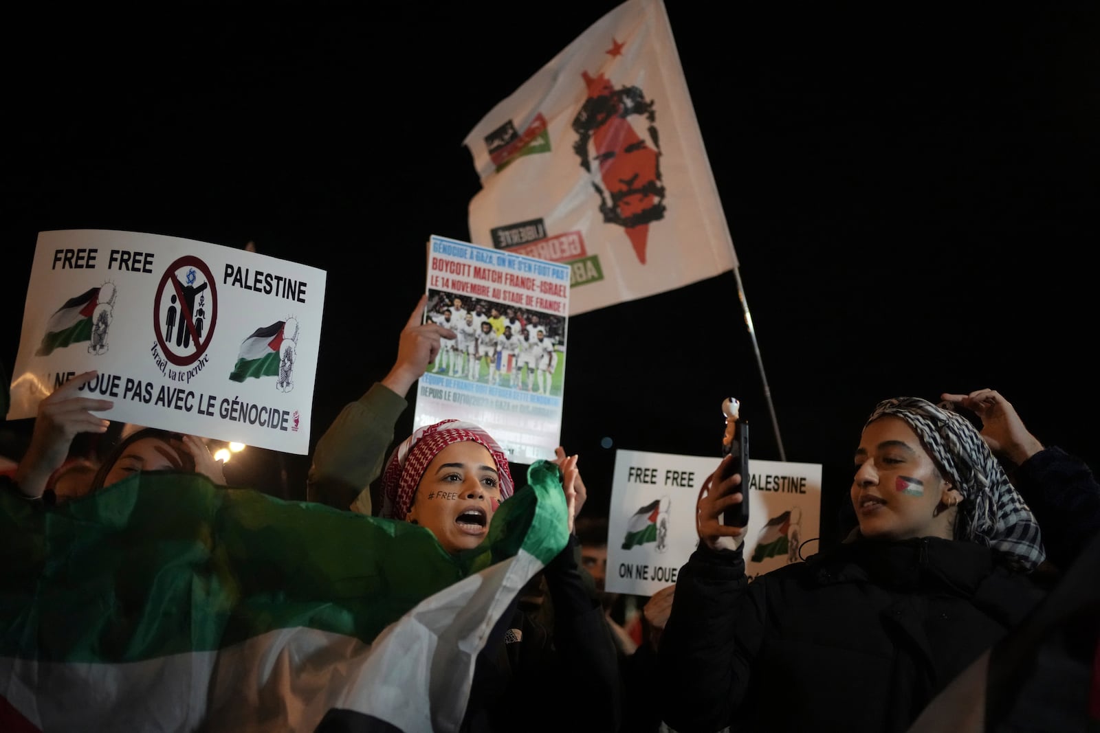 Demonstrators attend a rally in support of the Palestinian people, ahead of the Nations League soccer match France against Israel, Thursday, Nov. 14, 2024 in Saint-Denis, outside Paris. (AP Photo/Christophe Ena)