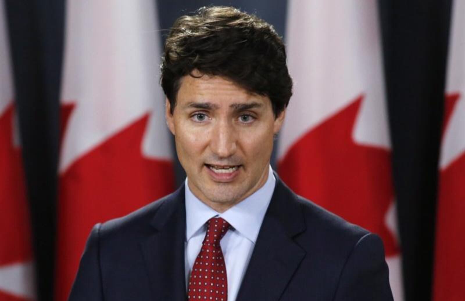 FILE- In this June 8, 2018, file photo, President Donald Trump talks with Canadian Prime Minister Justin Trudeau during a G-7 Summit welcome ceremony in Charlevoix, Canada. Canada announced Friday, June 29, billions of dollars in retaliatory tariffs against the U.S. in response to the Trump administration's duties on Canadian steel and aluminum, saying Friday it won't back down. (AP Photo/Evan Vucci, File)