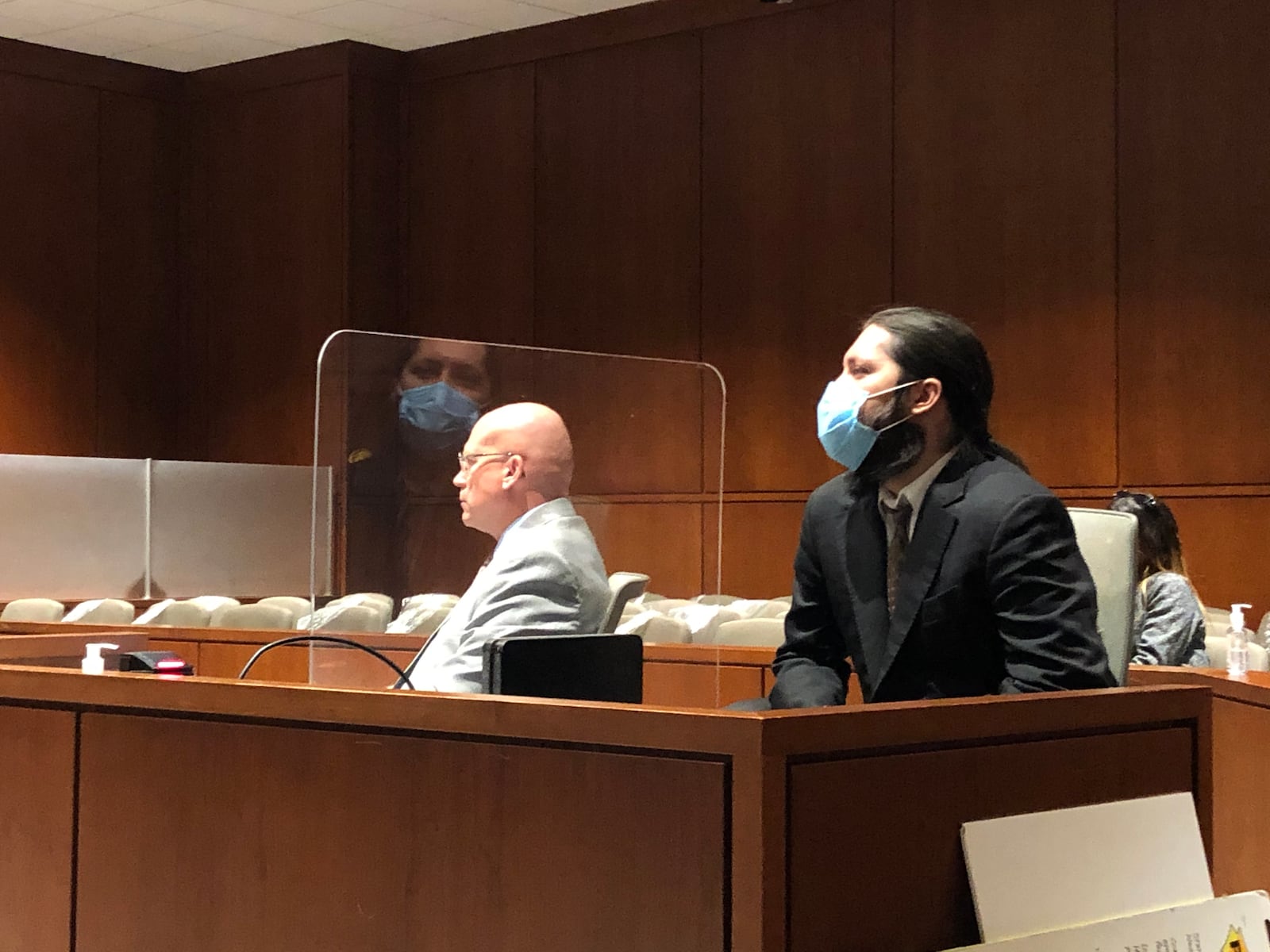 Brandon Dunham, at right listens with lawyer Jeff Meadows during final arguments in a trial in Warren County Common Pleas Court.