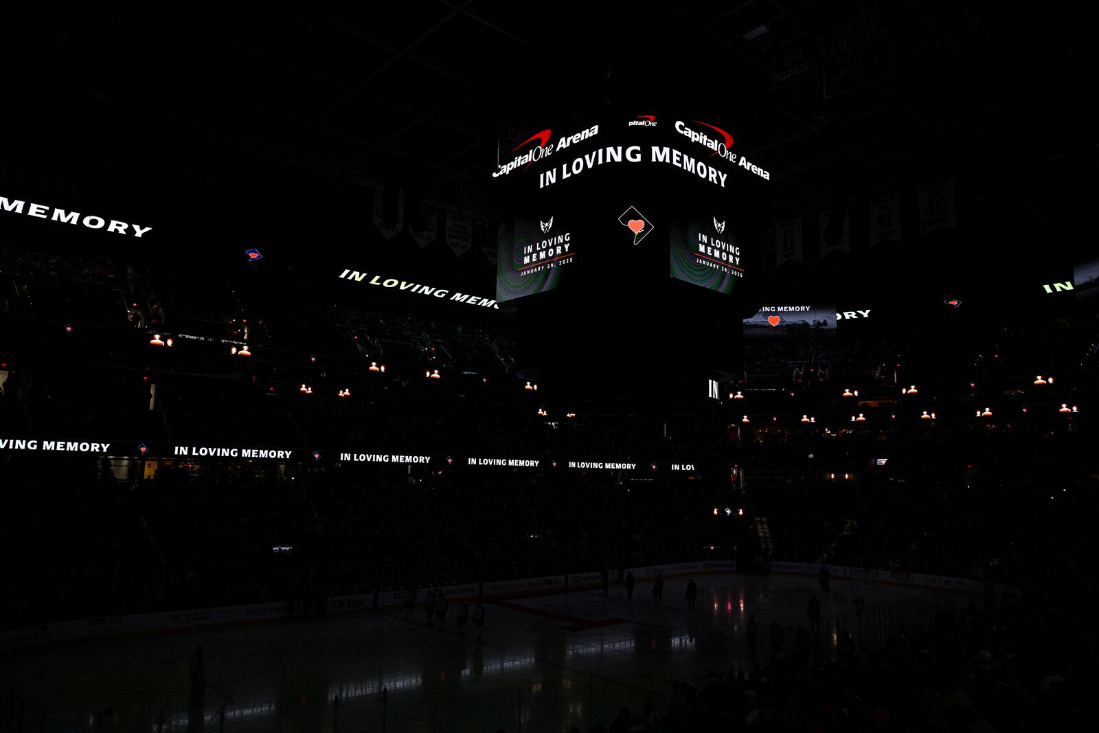 The scoreboard displays a tribute to the victims of the Washington-area plane crash before an NHL hockey game between the Washington Capitals and the Winnipeg Jets, Saturday, Feb. 1, 2025, in Washington. (AP Photo/Nick Wass)