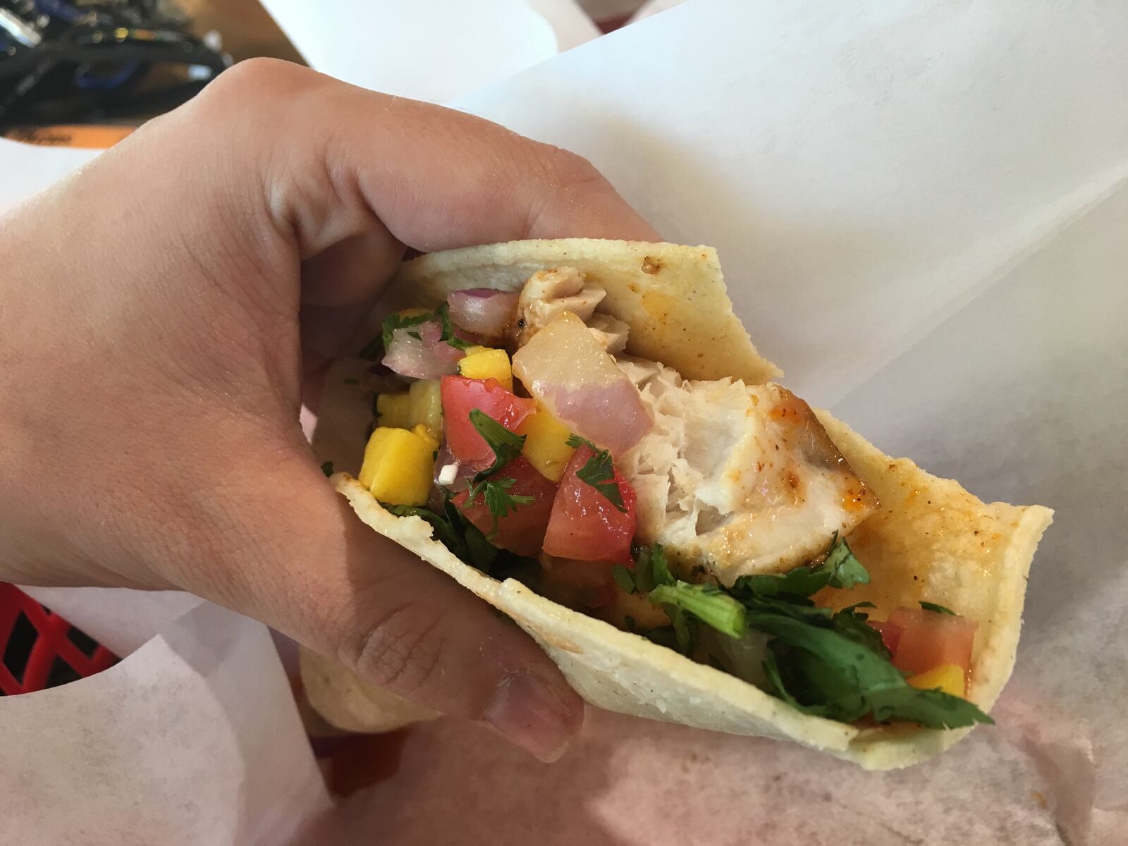 A very meaty bite of mahi mahi on the new mango mahi taco. Fuzzy's Taco Shop has a new summer menu that'll inspire you to live your best baja life. With tropical-inspired margaritas, shrimp burrito bowls and mahi mahi tacos topped with mango salsa, you'll be transported to a so-cal state of mind.