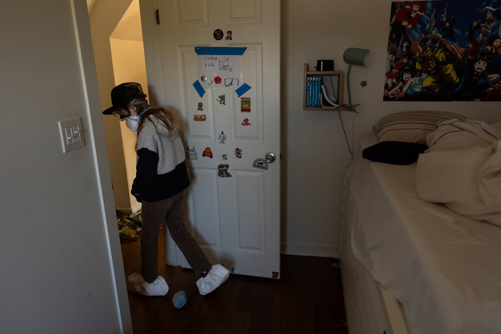 Ceiba Phillips, an 11-year-old Eaton Fire evacuee, walks out of his room as he visits his home for the first time since the fire, which destroyed his family's in-law suite, in Altadena, Calif., Saturday, Feb. 8, 2025. (AP Photo/Jae C. Hong)