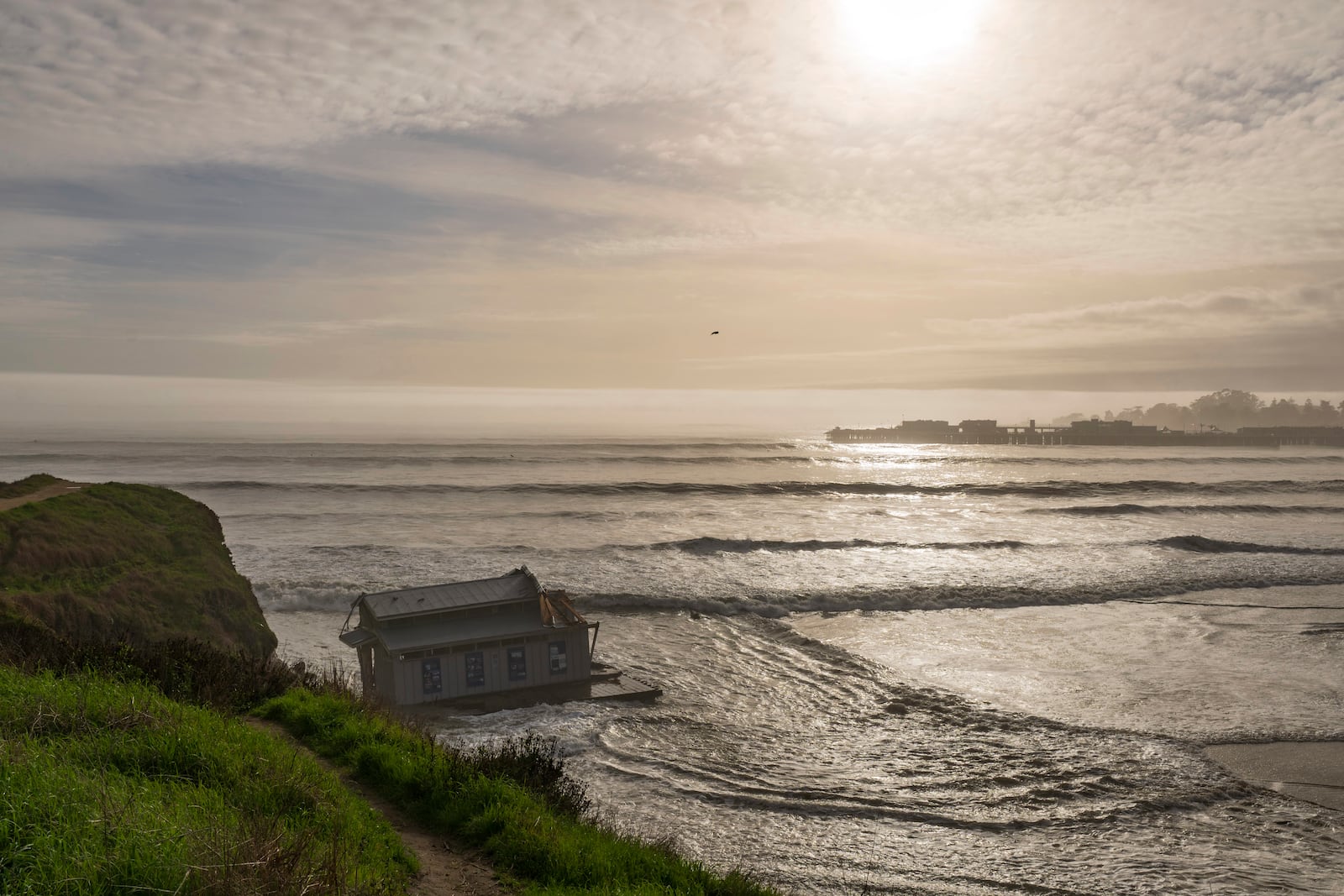 The remnants of a restaurant float at the head of the San Lorenzo River in Santa Cruz, Calif., Monday, Dec. 23, 2024. (AP Photo/Nic Coury)