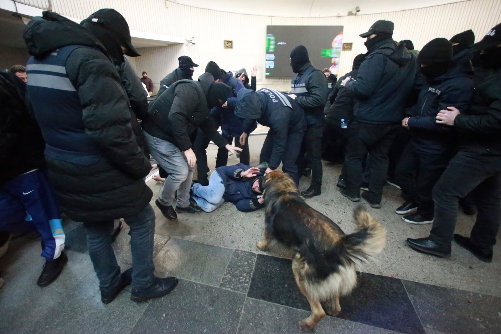 Police officers detain a demonstrator at a subway station during a rally against the government's decision to suspend negotiations on joining the European Union for four years in Tbilisi, Georgia, Monday, Dec. 2, 2024. (AP Photo/Zurab Tsertsvadze)