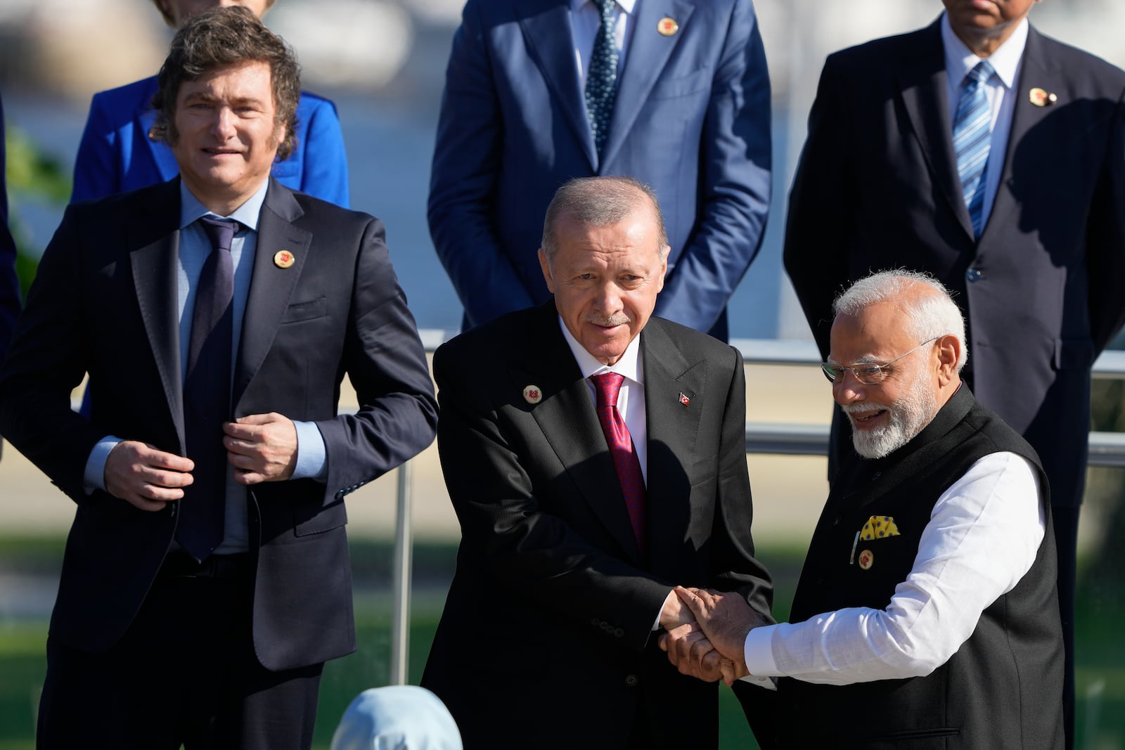 Argentina's President Javier Milei, left, Turkey's President Recep Tayyip Erdogan, center, and India's Prime Minister Narendra Modi prepare for a group photo at the G20 Summit in Rio de Janeiro, Monday, Nov. 18, 2024. (AP Photo/Eraldo Peres)