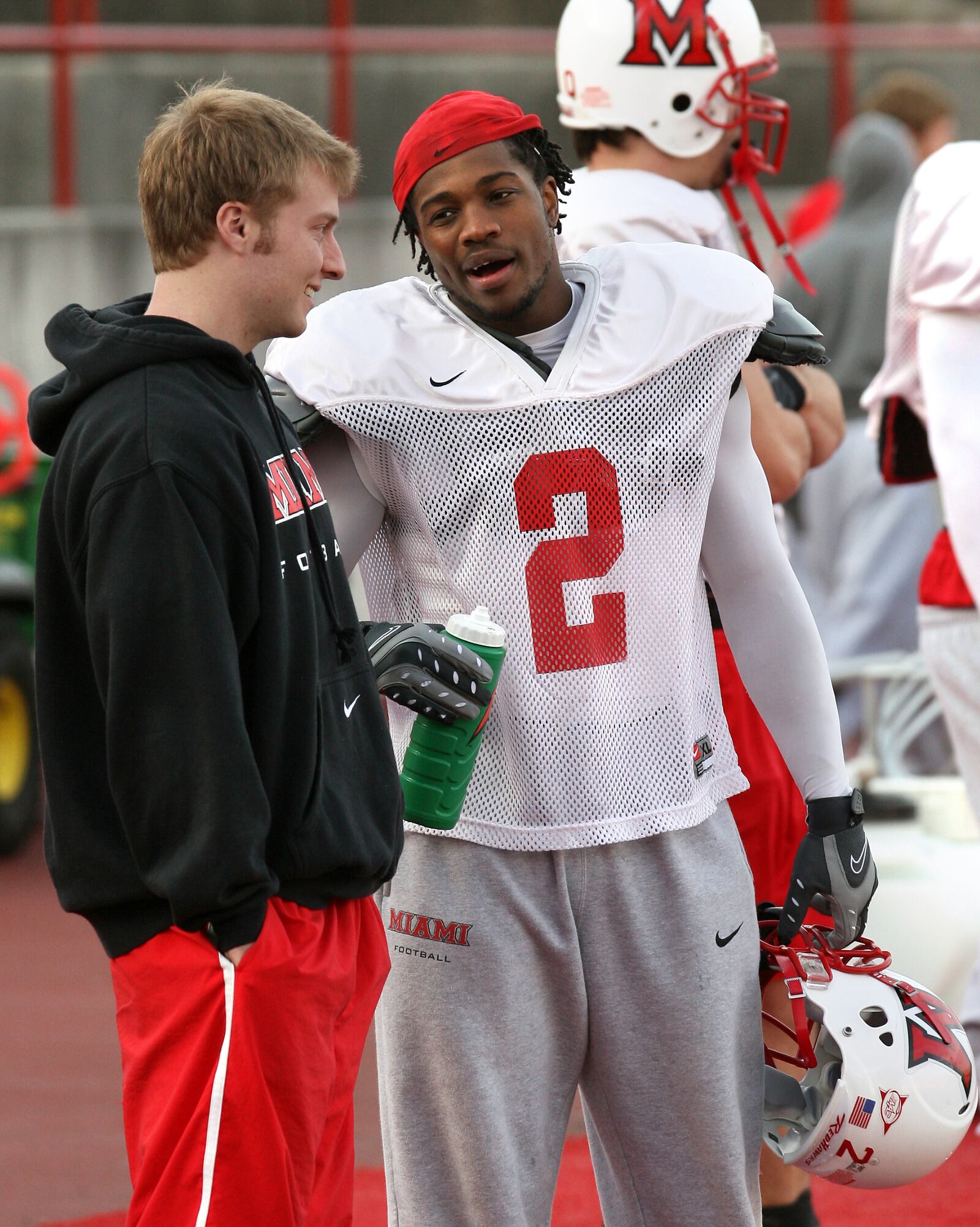 Eugene Harris((cq)) (2) talks with fellow wide receiver Sean McVay((cq)) during practice Wednesday at Yager Stadium in Oxford. Staff photo by Nick Daggy