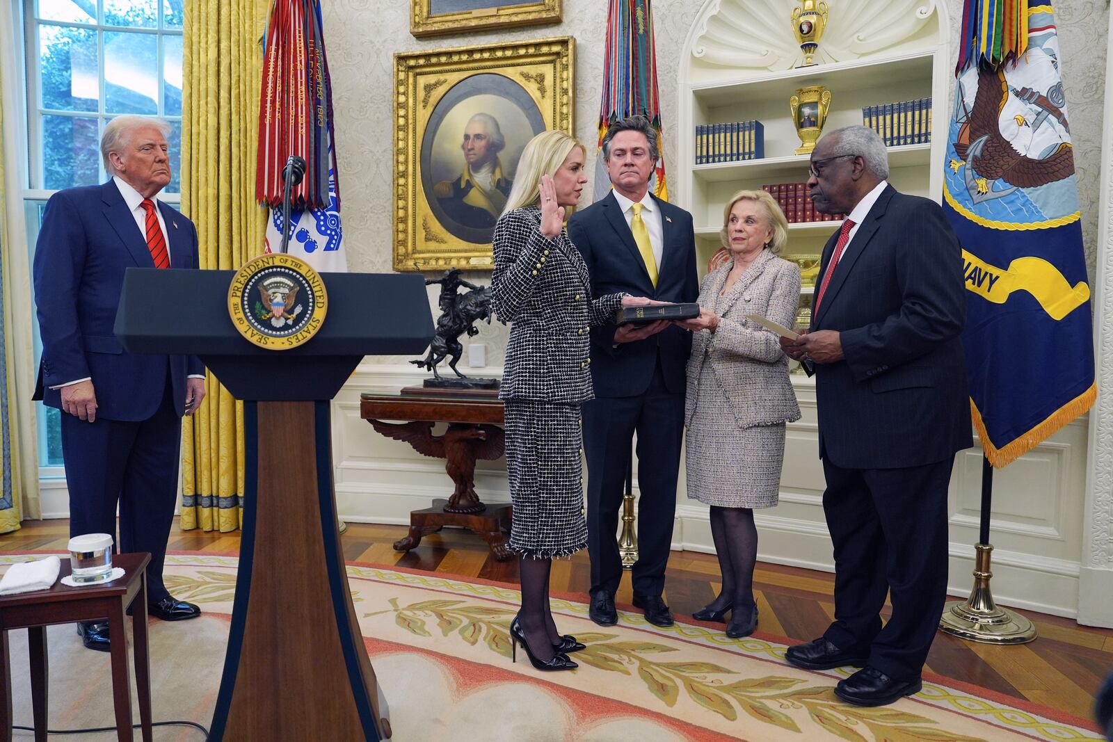 Pam Bondi is sworn in as Attorney General by Supreme Court Associate Justice Clarence Thomas, right, as President Donald Trump, partner John Wakefield and mother Patsy Bondi, look on, in the Oval Office of the White House, Wednesday, Feb. 5, 2025, in Washington. (AP Photo/Evan Vucci)