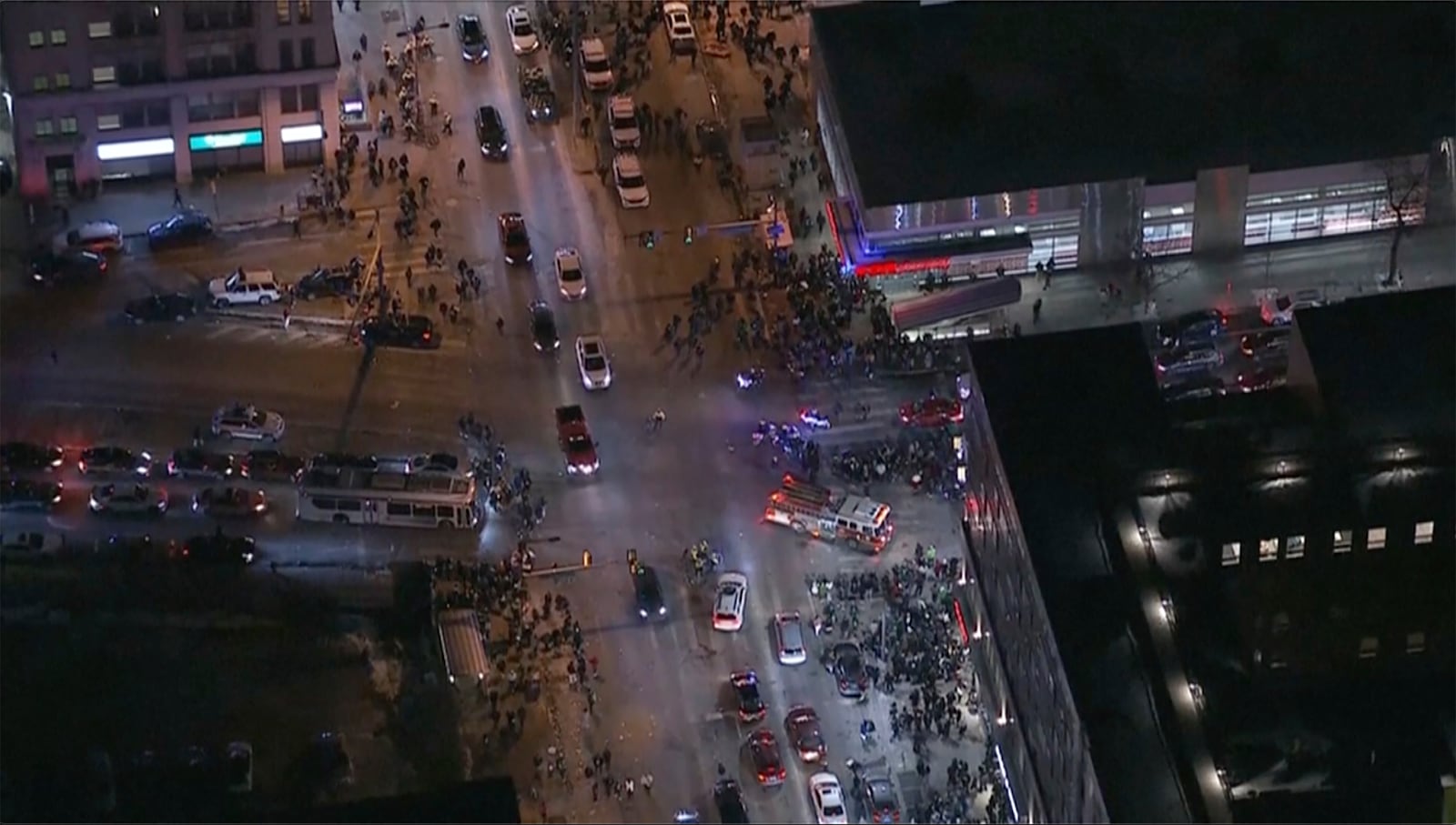 In this image from a video, emergency and law enforcement vehicles are parked near the scene after a car, police said, hit and injured pedestrians in a crowd of people that was leaving the Philadelphia Eagles playoff game, in Philadelphia, Sunday, Jan. 26, 2025. (WPVI-TV/6ABC via AP)