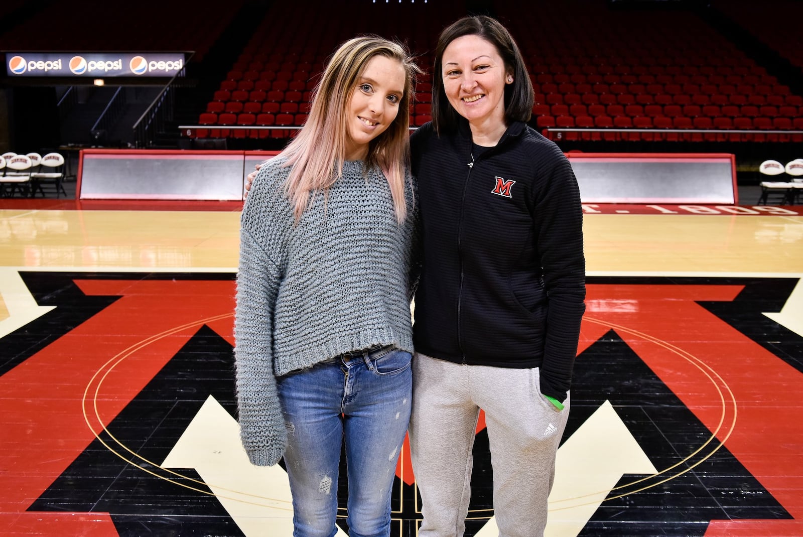 Jordan Ryan, left, stands with Veronica Mullen, director of basketball operations for Miami University women’s basketball team, at Millett Hall Tuesday, Feb. 5 in Oxford. Mullen donated a kidney to Ryan. NICK GRAHAM/STAFF