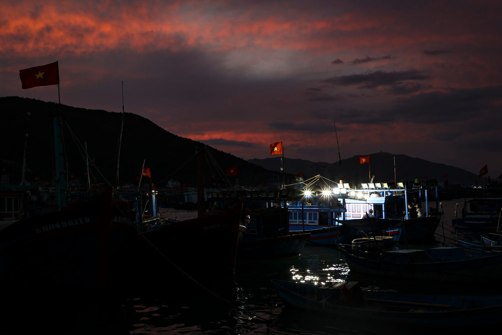 Fishing boats moored during sunset in the Nha Trang harbor to go squid fishing on Feb. 7, 2025, in Nha Trang, Vietnam. (AP Photo/Yannick Peterhans)