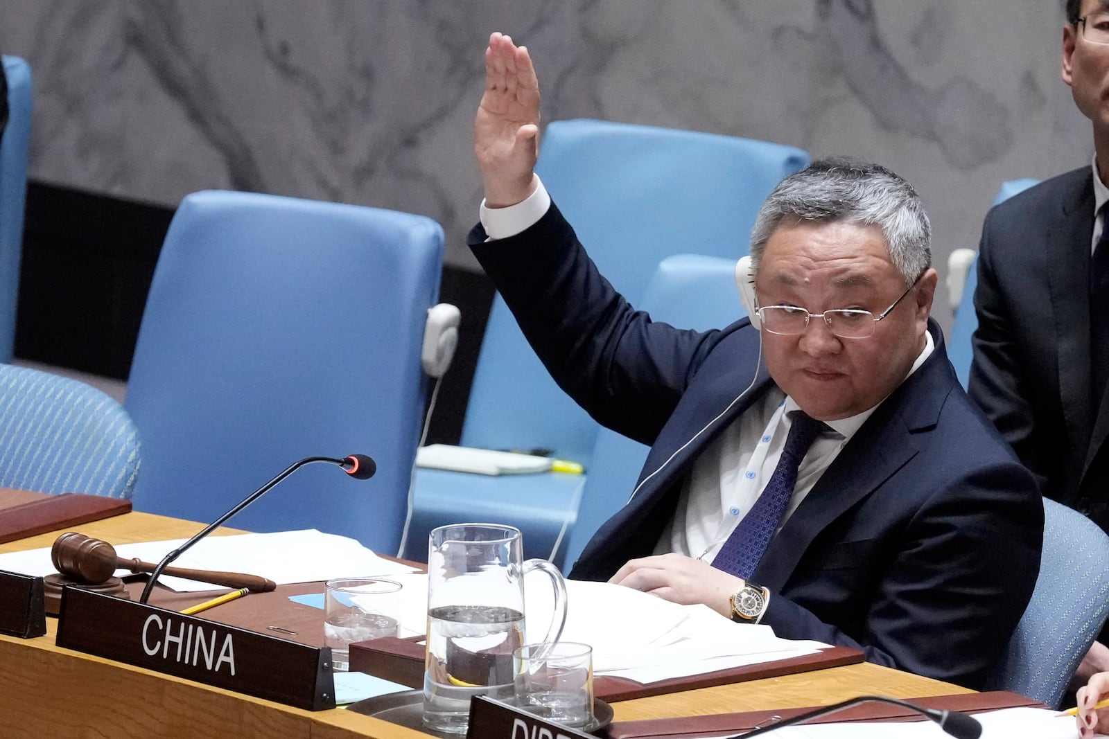 China Ambassador, and current Security Council President Fu Cong votes in the UN Security Council, Monday, Feb. 24, 2025, at the United Nations headquarters. (AP Photo/Richard Drew)