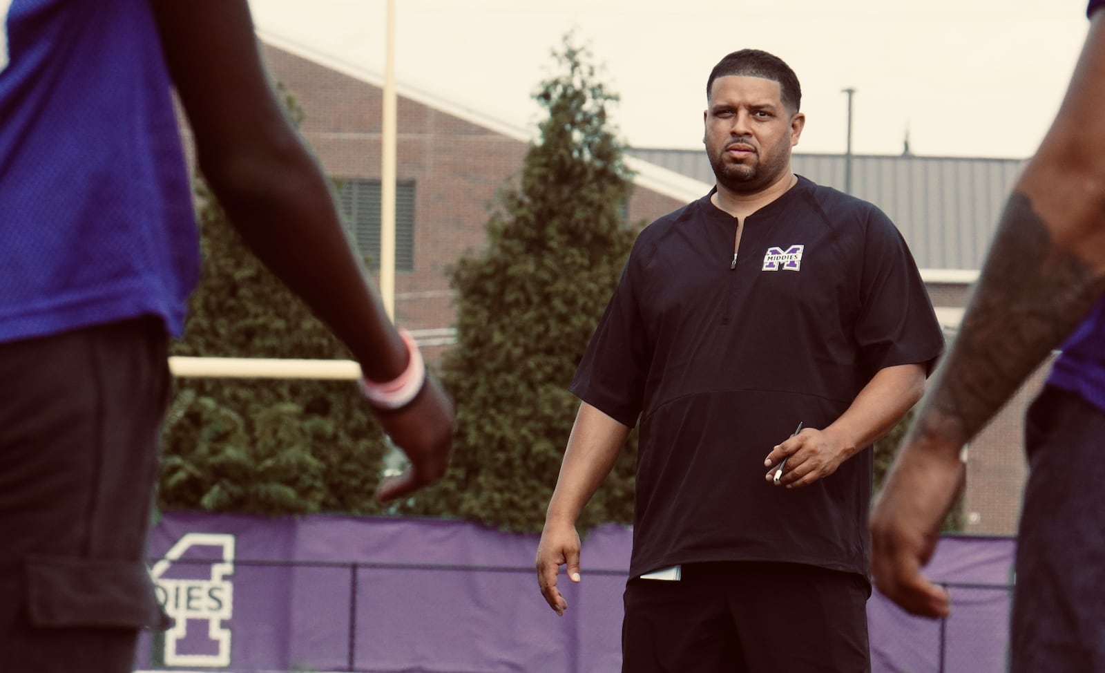 Middletown football coach Kali Jones runs a drill during a practice in July 2024. Photo by Chris Vogt