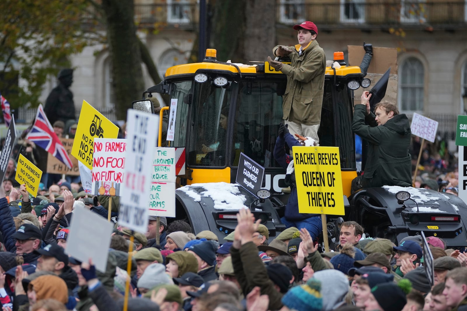 The National Farmers' Union members attend a protest against the planned changes to tax rules, in London, Tuesday, Nov. 19, 2024. (AP Photo/Kin Cheung)