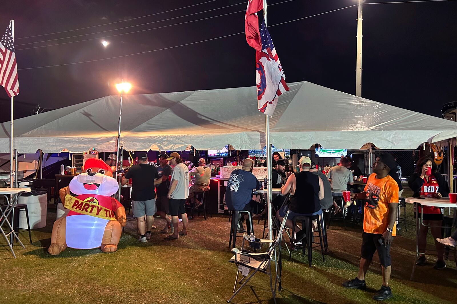 NASCAR fans party at the Red 38 bar at the Daytona International Speedway infield. Wednesday, Feb 12, 2025 in Daytona Beach , Fla (AP Photo/ Mark Long)