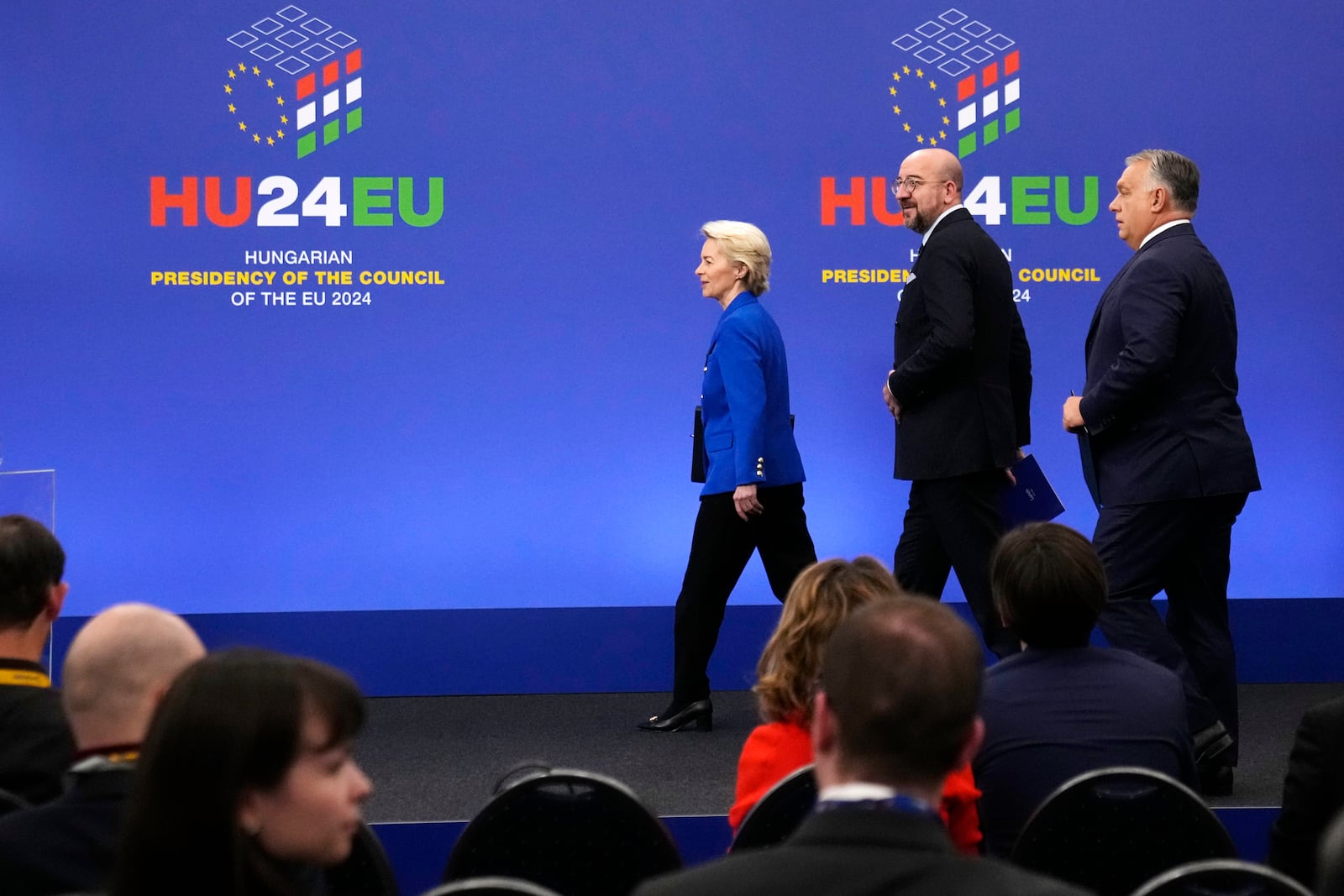 From left, European Commission President Ursula von der Leyen, European Council President Charles Michel and Hungary's Prime Minister Viktor Orban arrive for a media conference at the end of an EU Summit at the Puskas Arena in Budapest, Hungary, Friday, Nov. 8, 2024. (AP Photo/Petr David Josek)