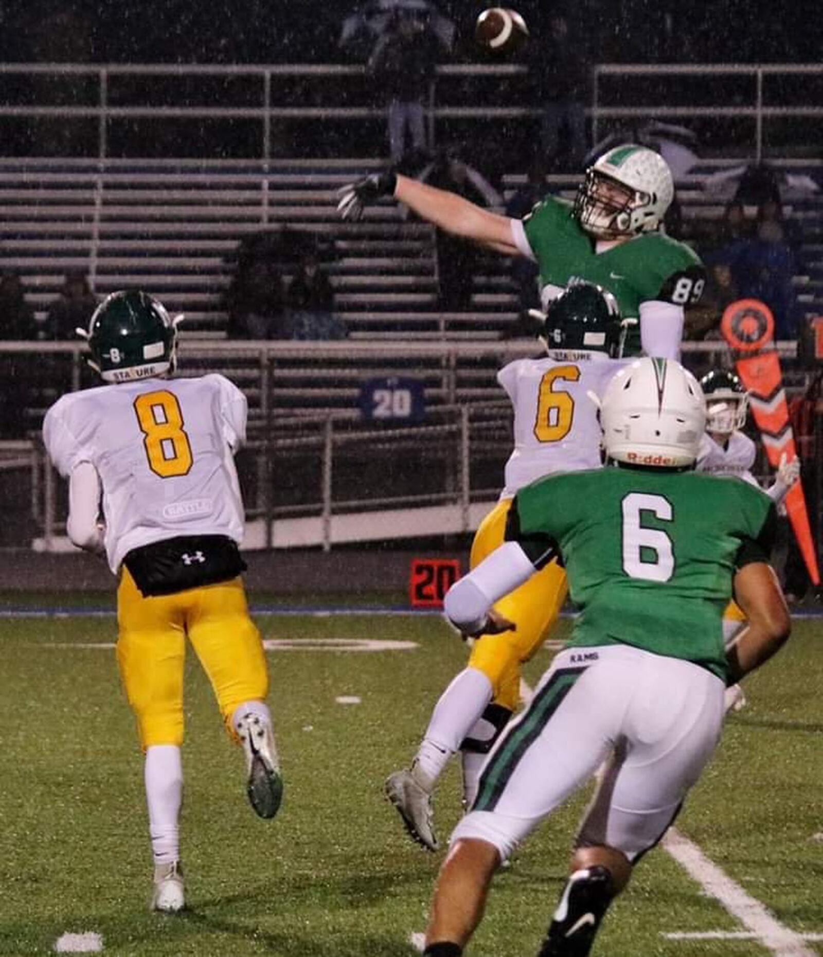 Badin’s Grayson Taylor (89) goes after a pass thrown by McNicholas quarterback Pierce Taylor (8) on Friday night at Virgil Schwarm Stadium in Hamilton. CONTRIBUTED PHOTO BY TERRI ADAMS