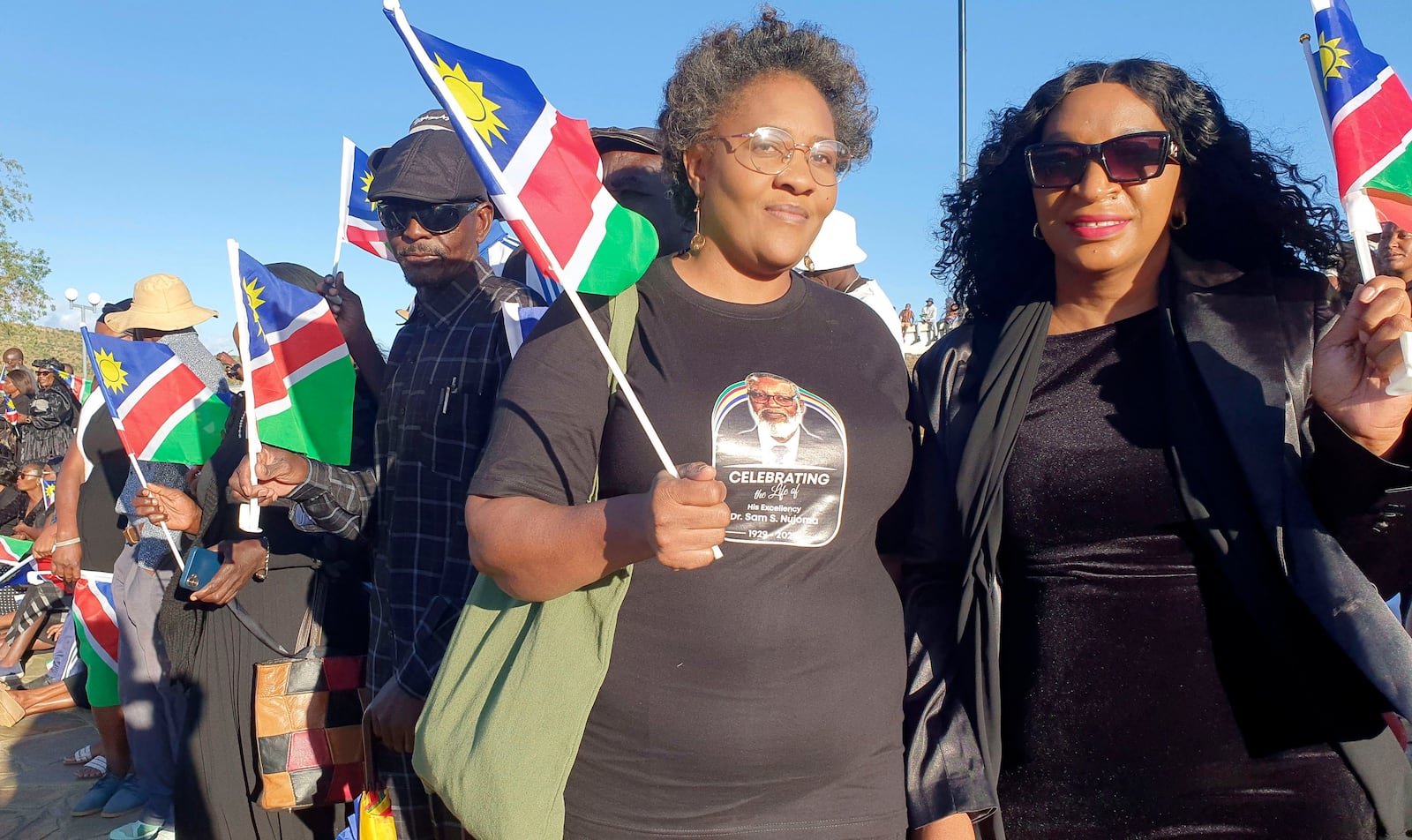 People gather for the state funeral for Namibia's founding president Sam Nujoma at Heroes' Acre, in Windhoek, Namibia, Saturday, March 1, 2025. (AP Photo/Dirk Heinrich)