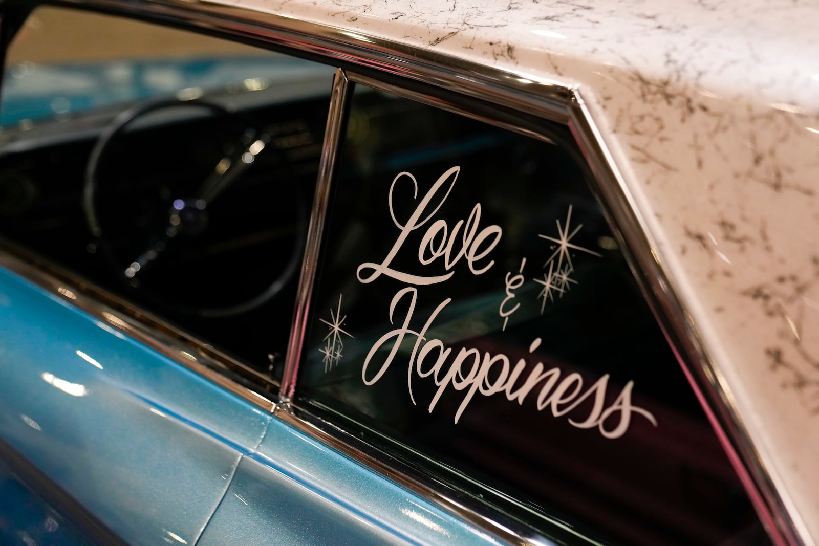 A lowrider car is on display at the Slow & Low Chicago Lowrider Festival, Saturday, Oct. 12, 2024, at Navy Pier in Chicago. (AP Photo/Erin Hooley)