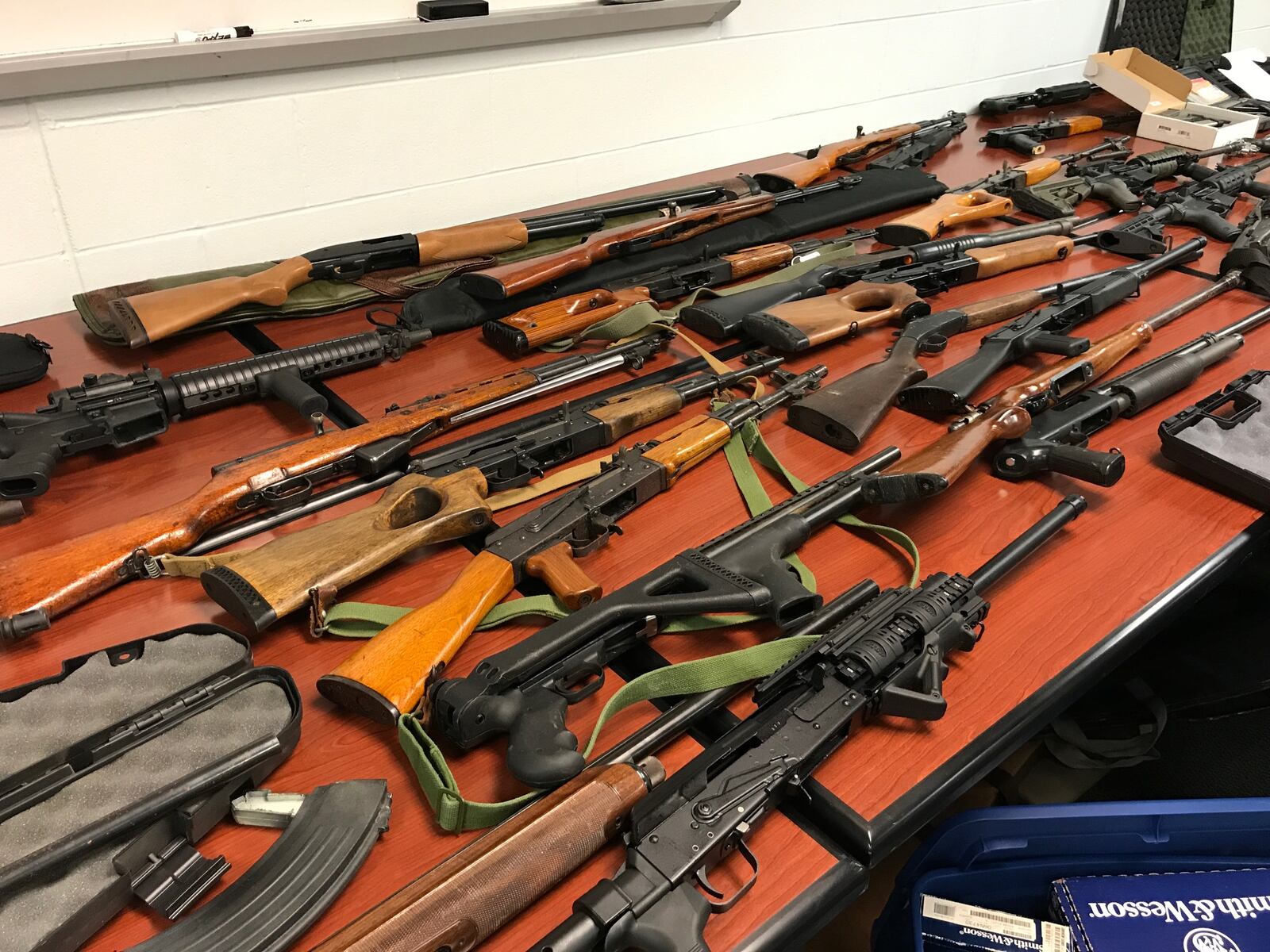 More that 100 firearms seized from a West Chester Twp. home displayed at the Butler County Sheriff’s Office. NICK GRAHAM/STAFF