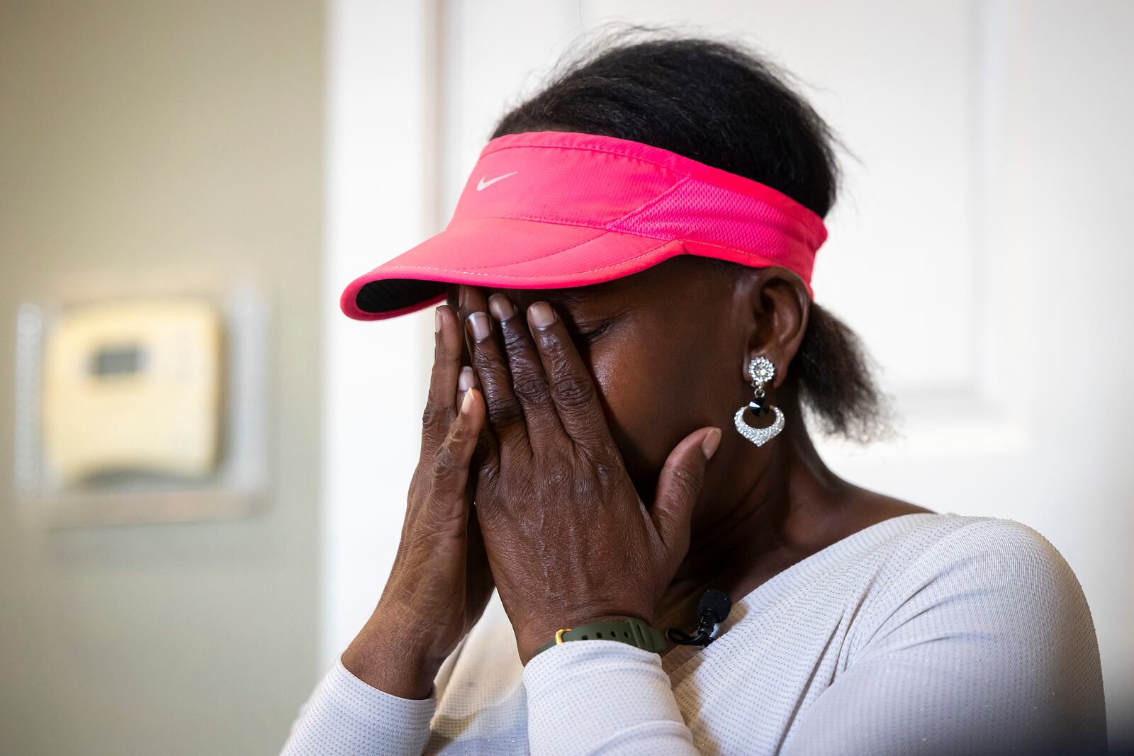 Mary Burks becomes emotional as she repeatedly questions who will help those suffering after a hurricane during an interview at Commons of Grace Senior on Wednesday, Sept. 25, 2024, in Houston. (AP Photo / Annie Mulligan)