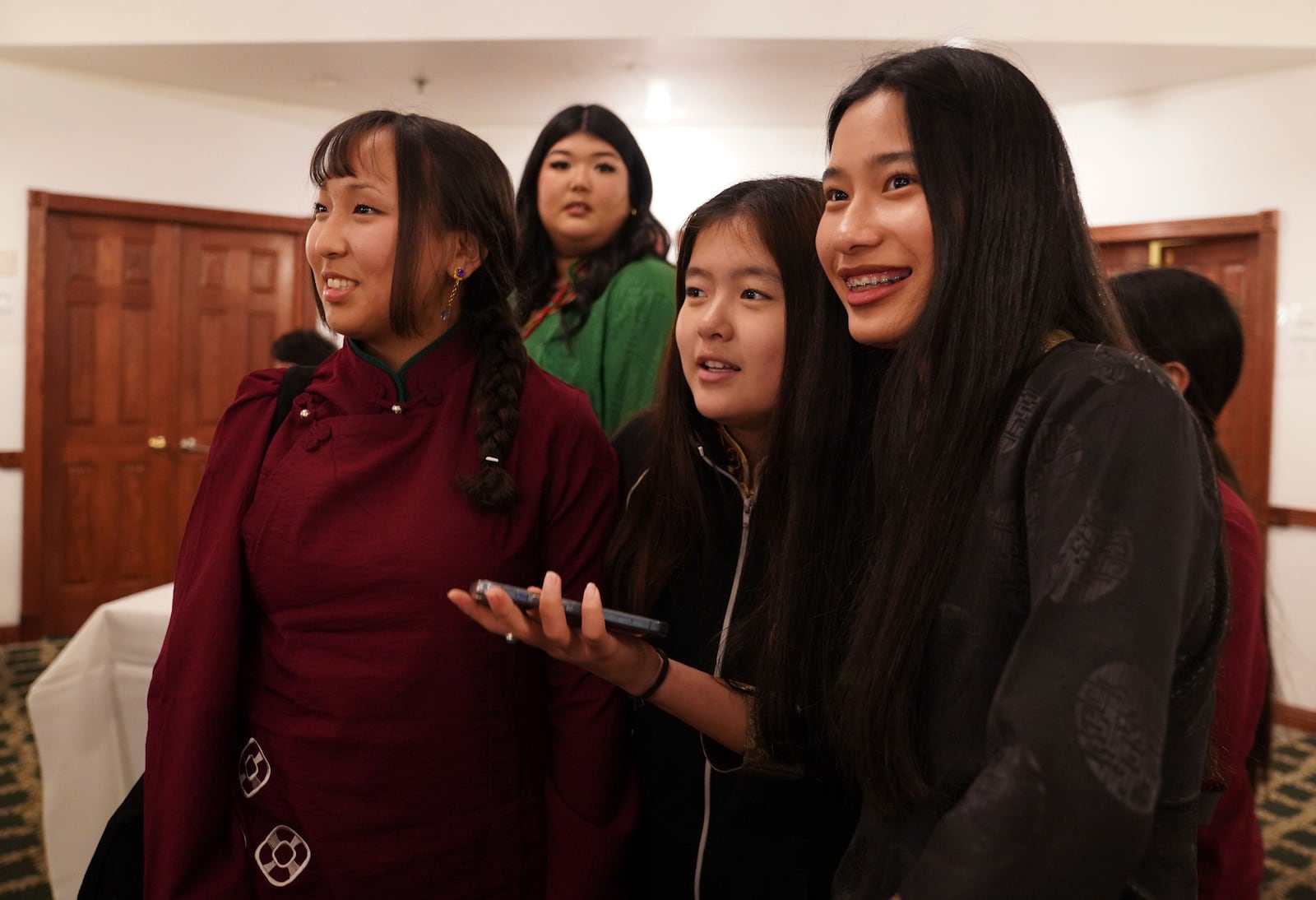 Friends, family, and community members attend the 18th birthday and enthronement ceremony of U.S.-born Buddhist lama, Jalue Dorje, at the Tibetan American Foundation of Minnesota in Isanti, Minn., on Saturday, Nov. 9, 2024. (AP Photo/Jessie Wardarski)