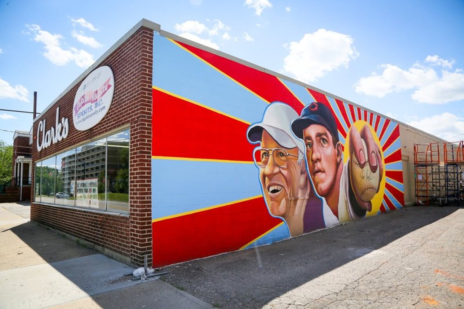 The new Hamilton mural featuring Cincinnati Reds legend, Joe Nuxhall, painted on the side of Clark’s Sporting Goods on Hamilton s west side. GREG LYNCH / STAFF