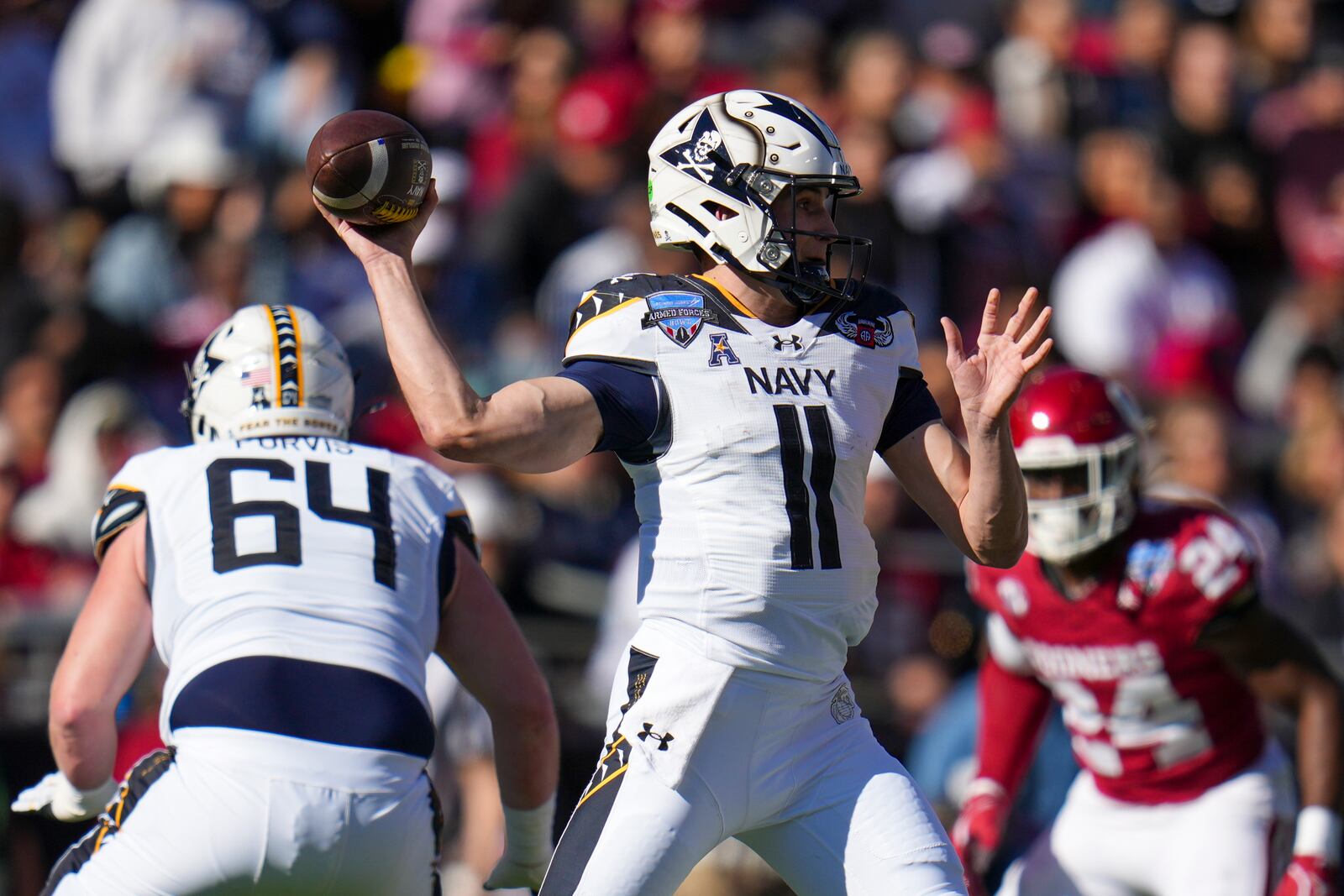 Navy quarterback Blake Horvath throws a pass against Oklahoma during the first half of the Armed Forces Bowl NCAA college football game, Friday, Dec. 27, 2024, in Fort Worth, Texas. (AP Photo/Julio Cortez)