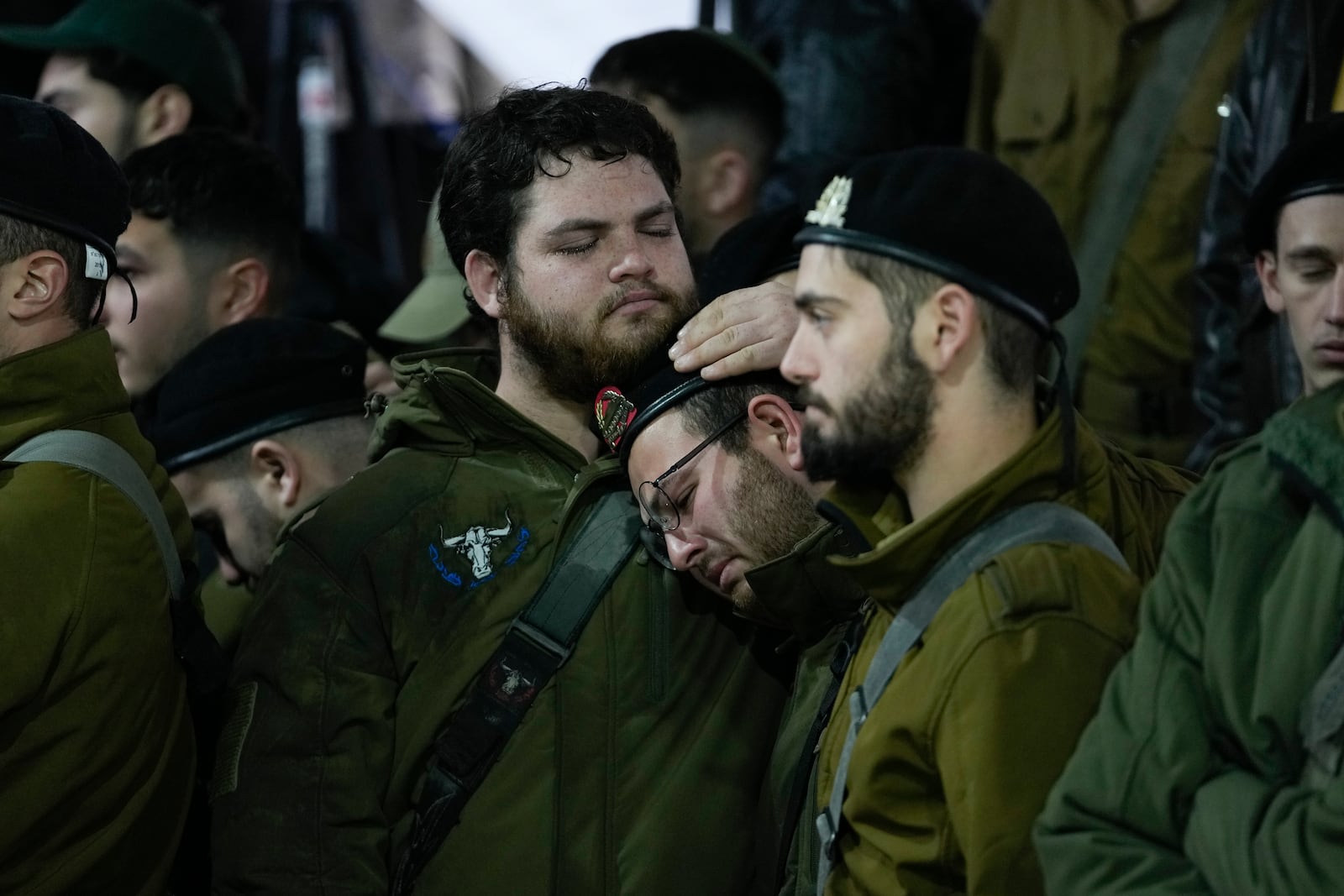 People attend the funeral of 1st Sgt. Yuval Shoham, who was killed in a battle in the Gaza Strip, at Mount Herzl military cemetery in Jerusalem, Monday, Dec. 30, 2024. (AP Photo/Matias Delacroix)