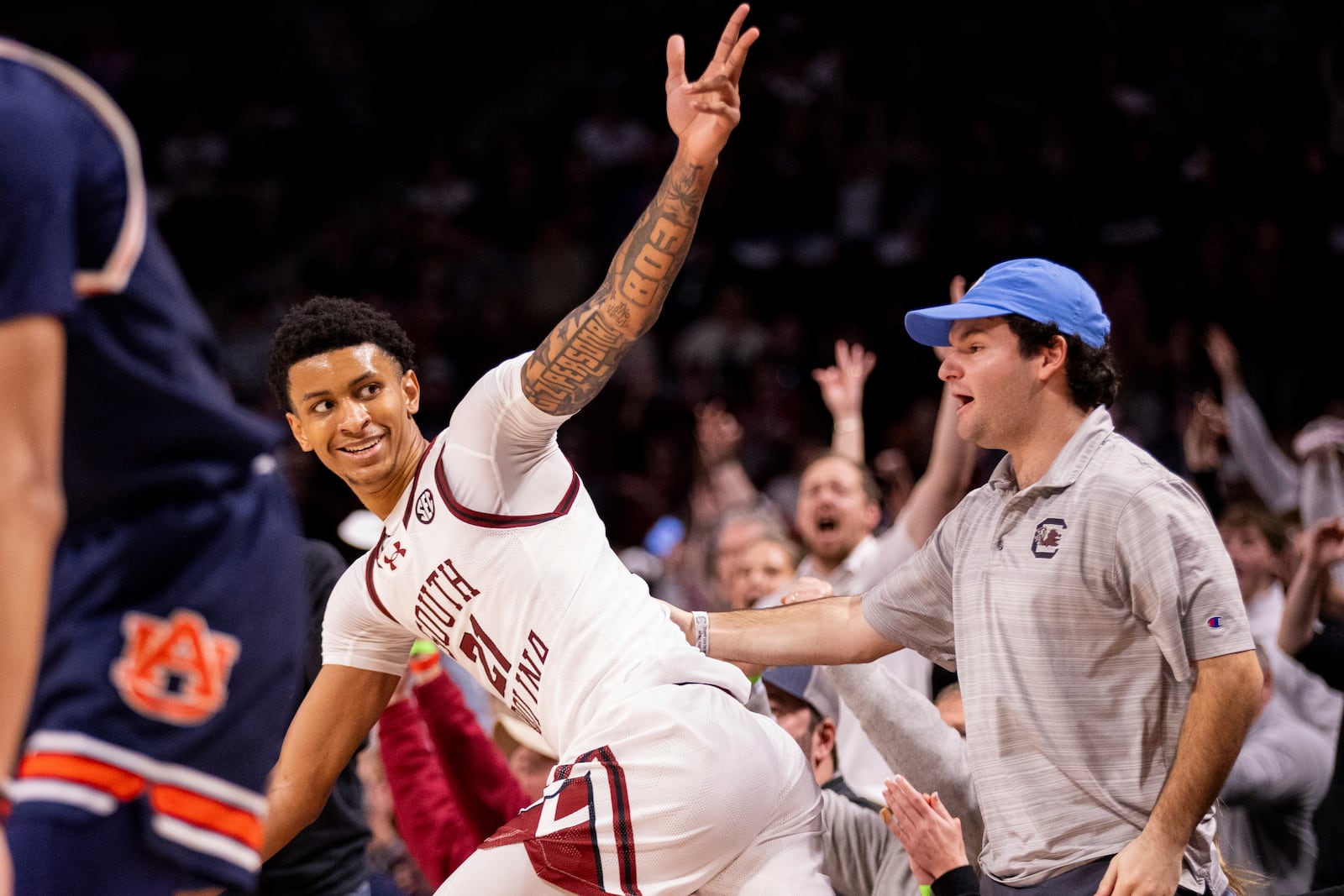 South Carolina guard Arden Conyers (21) celebrates a 3-point basket against the Auburn during the second half of an NCAA college basketball game on Saturday, Jan. 11, 2025, in Columbia, SC (AP Photo/Scott Kinser)