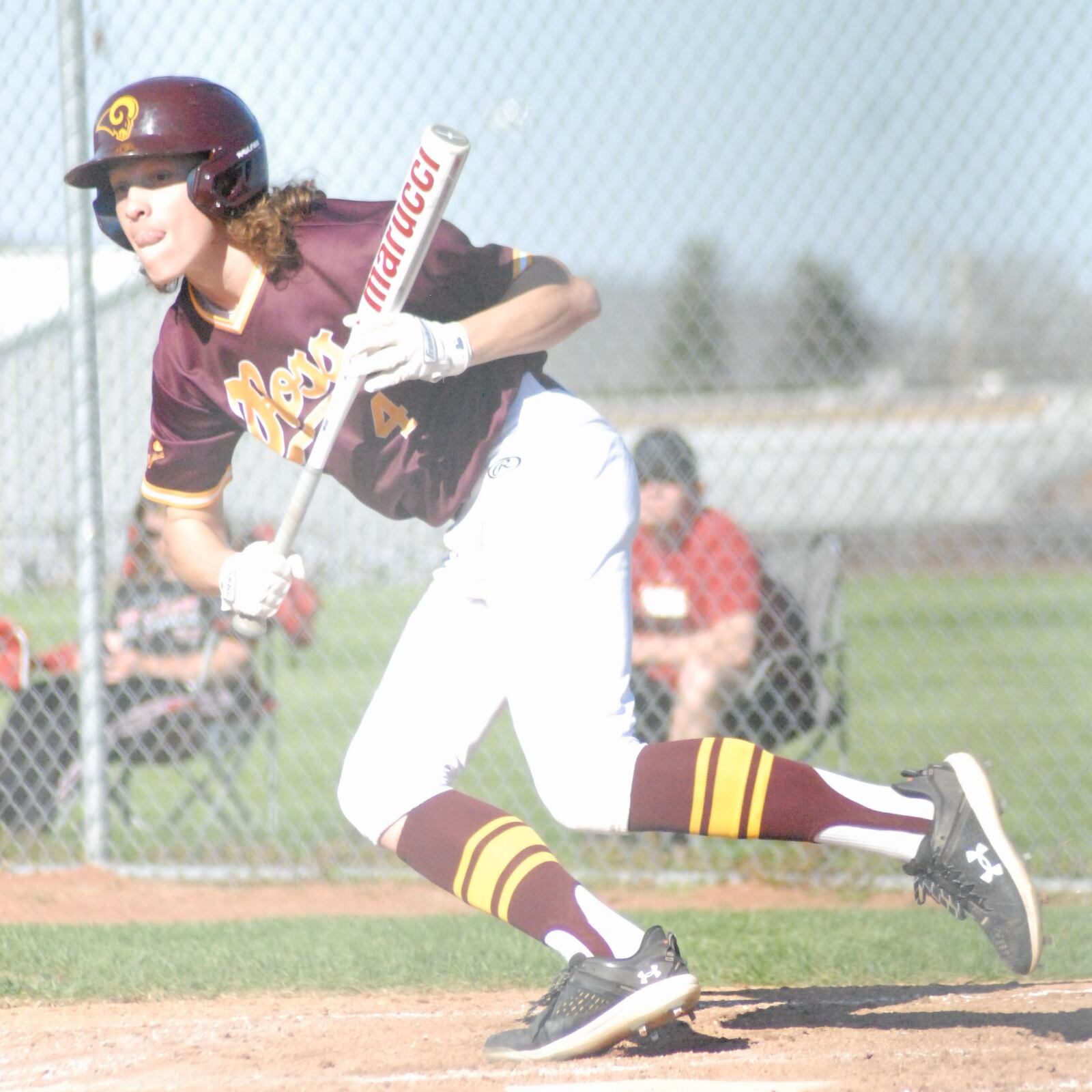 Ross senior Ben Voegele drops down a bunt against Landmark Christian on Tuesday. Chris Vogt/CONTRIBUTED