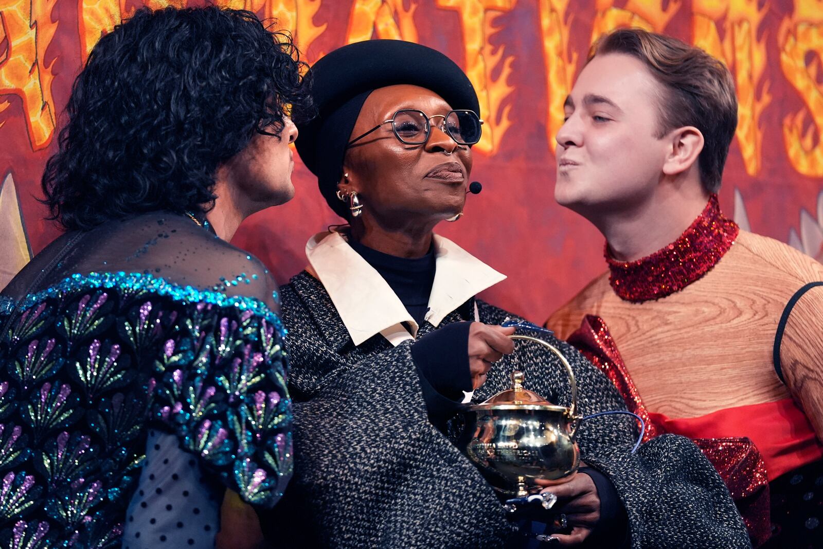 Harvard University's Hasty Pudding Theatricals Woman of the Year Cynthia Erivo is kissed by two character actors during a roast, Wednesday, Feb. 5, 2025, in Cambridge, Mass. (AP Photo/Charles Krupa)