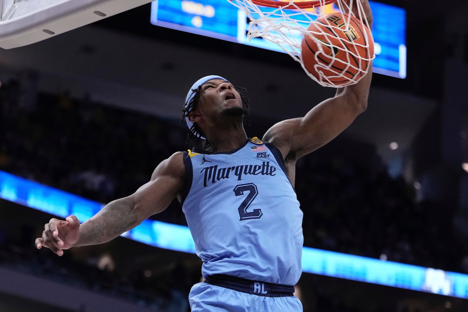 Marquette's Chase Ross dunks during the first half of an NCAA college basketball game Saturday, Mar. 8, 2025, in Milwaukee. (AP Photo/Morry Gash)