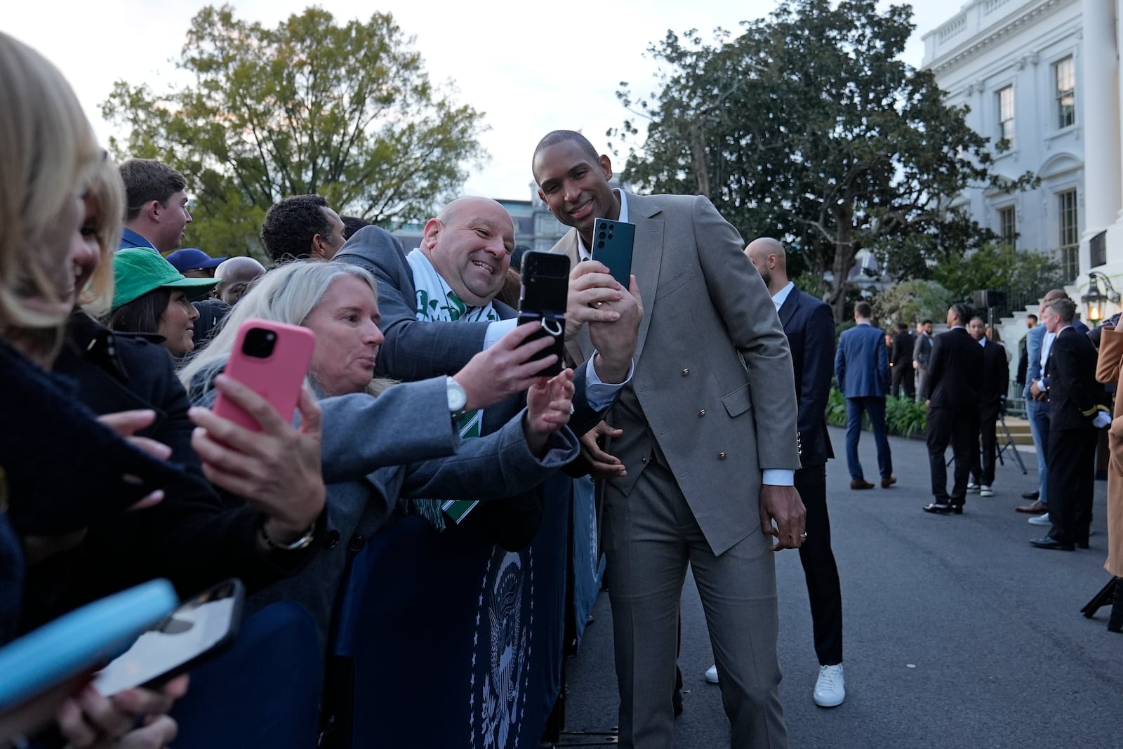 Boston Celtics Al Horford, center, poses with guests during an event with President Joe Biden to celebrate the Celtics victory in the 2024 National Basketball Association Championship, on the South Lawn of the White House in Washington, Thursday, Nov. 21, 2024. (AP Photo/Susan Walsh)