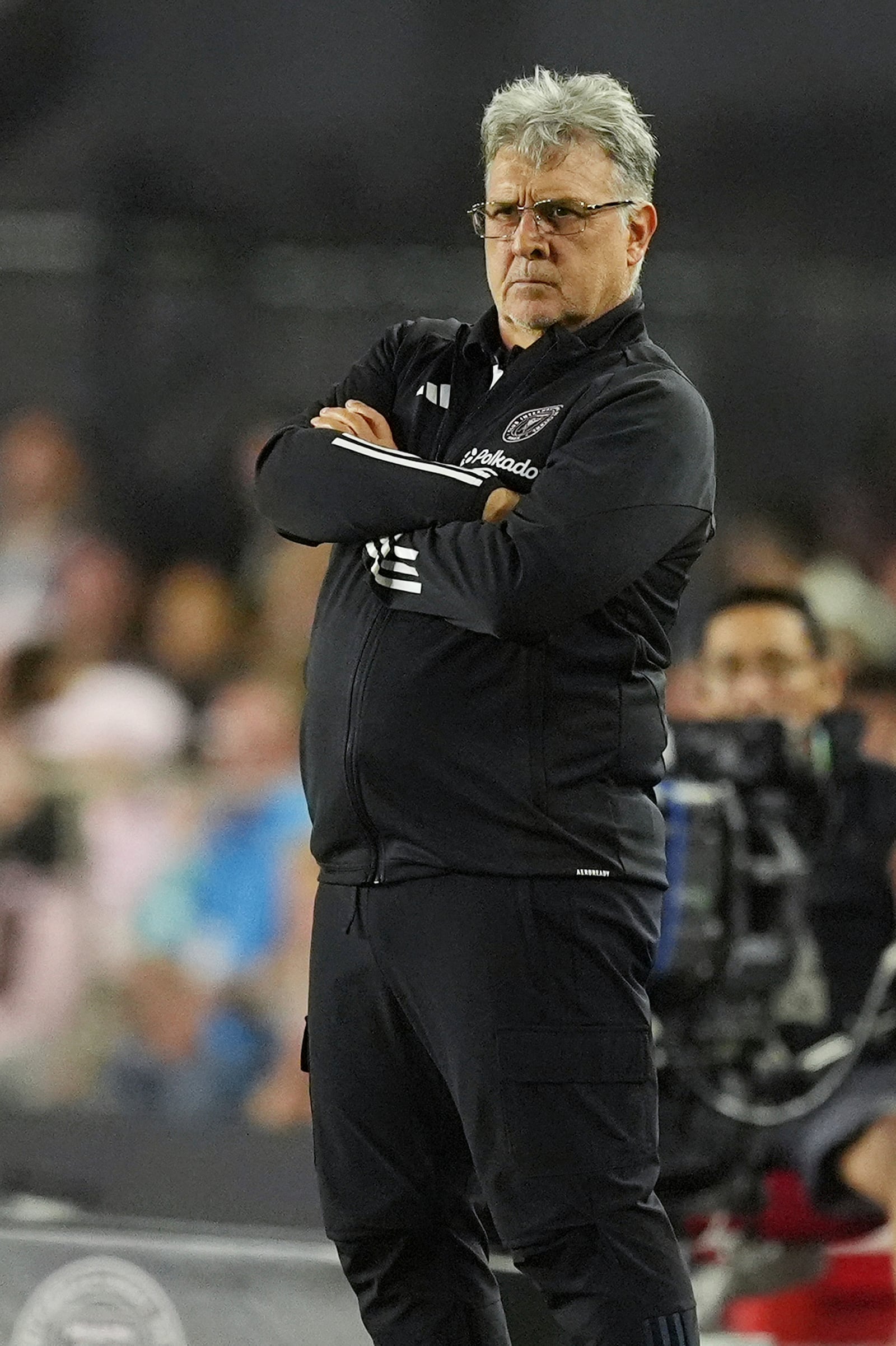 Inter Miami head coach Gerardo "Tata" Martino stands on the sidelines during the first half of an MLS playoff opening round soccer match against Atlanta United, Saturday, Nov. 9, 2024, in Fort Lauderdale, Fla. (AP Photo/Rebecca Blackwell)