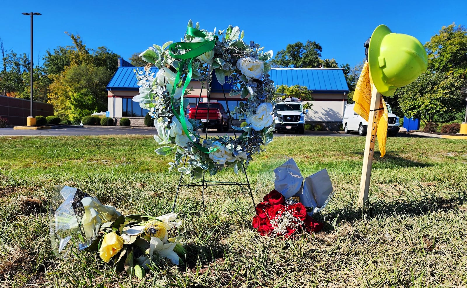 Memorial at the paver accident crash site on Main Street in Hamilton where Jacob Moler was killed and Damion Winkler injured on Oct. 3. NICK GRAHAM/STAFF