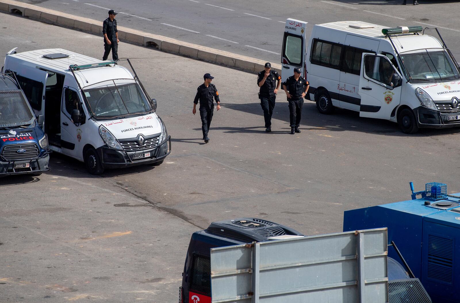 Moroccan security forces stand guard outside the border with the Spanish enclave of Ceuta, in Fnideq, Morocco, Monday, Sept. 16, 2024. (AP Photo)