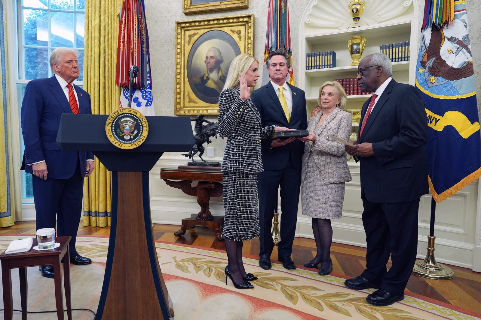 Pam Bondi is sworn in as Attorney General by Supreme Court Associate Justice Clarence Thomas, right, as President Donald Trump, partner John Wakefield and mother Patsy Bondi, look on, in the Oval Office of the White House, Wednesday, Feb. 5, 2025, in Washington. (AP Photo/Evan Vucci)