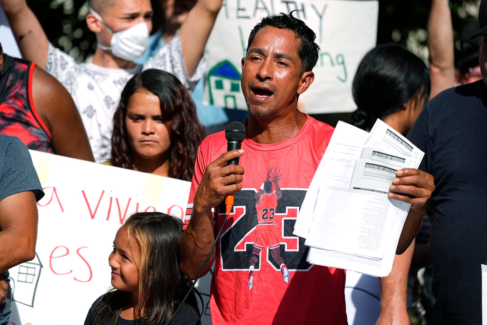 FILE - Juan Carlos Jimenez speaks during a rally by the East Colfax Community Collective to address chronic problems in the apartment buildings occupied by people displaced from their home countries in central and South America Sept. 3, 2024, in Aurora, Colo. (AP Photo/David Zalubowski, File)